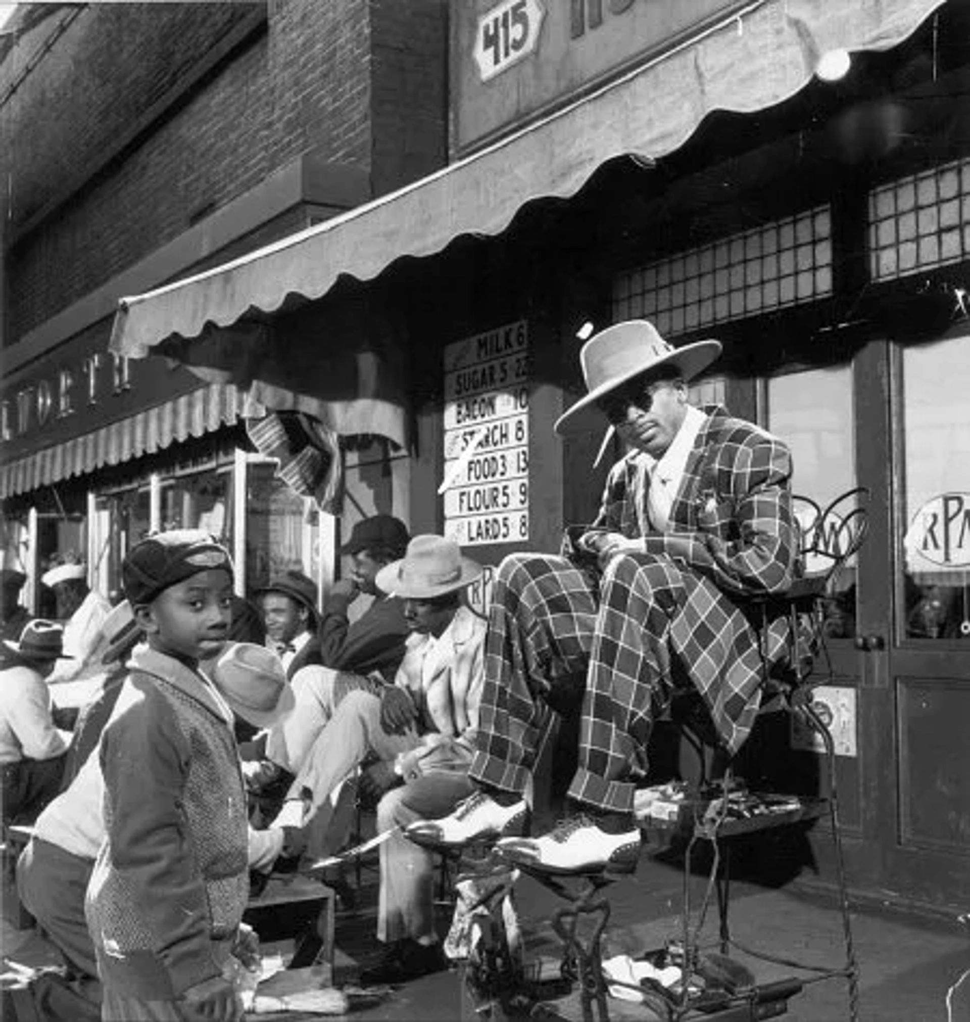 Photo of Spike Lee from "Malcolm X", wearing Zoot Suit designed by Ruth Carter.