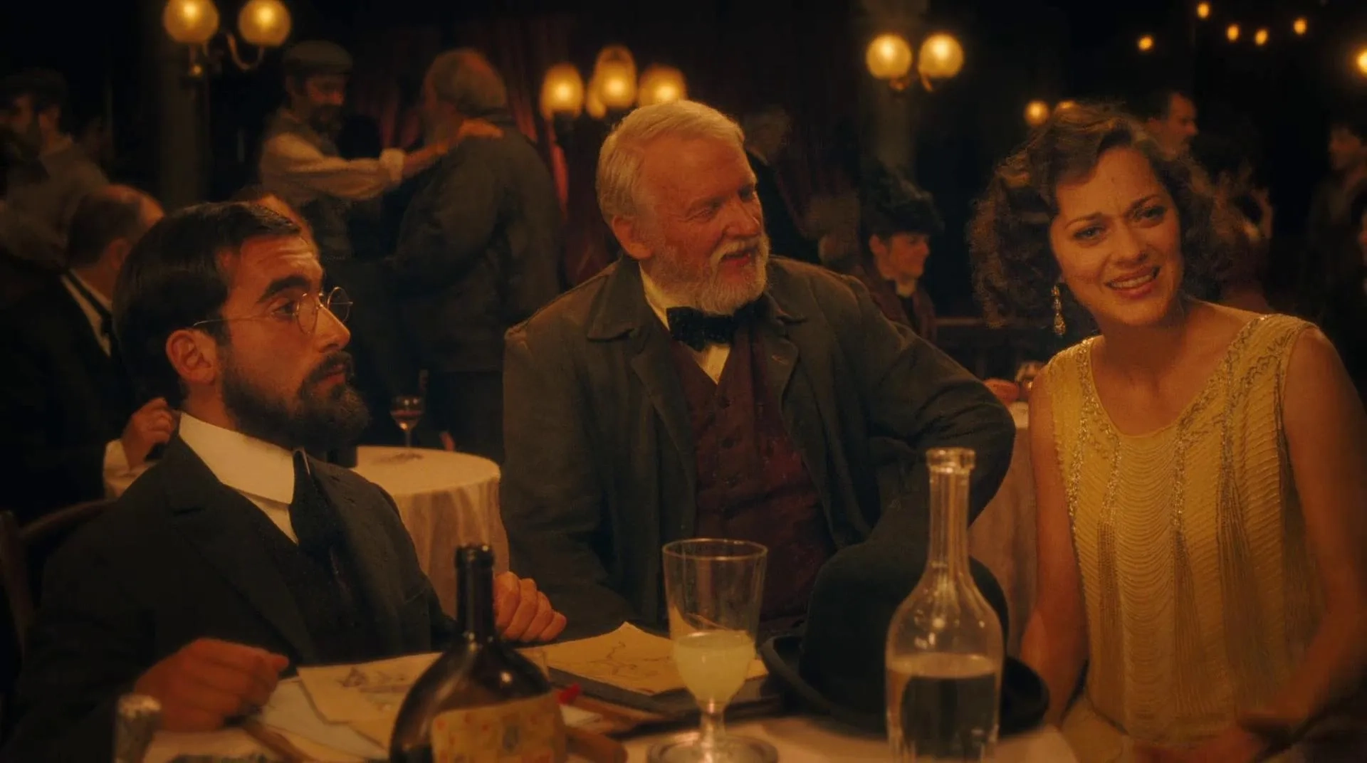 Marion Cotillard, Olivier Rabourdin, and Vincent Menjou Cortes in Midnight in Paris (2011)