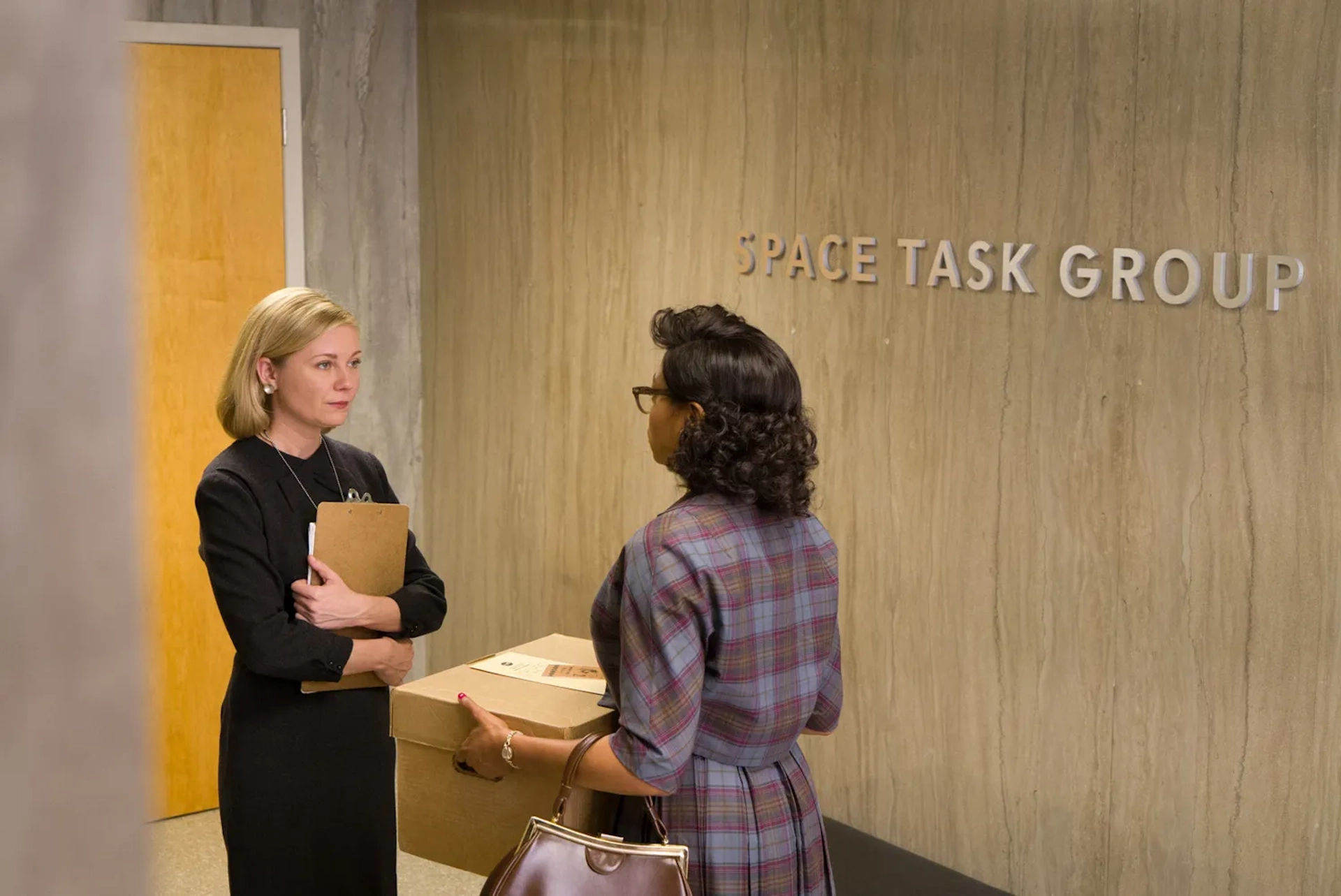 Kirsten Dunst and Taraji P. Henson in Hidden Figures (2016)