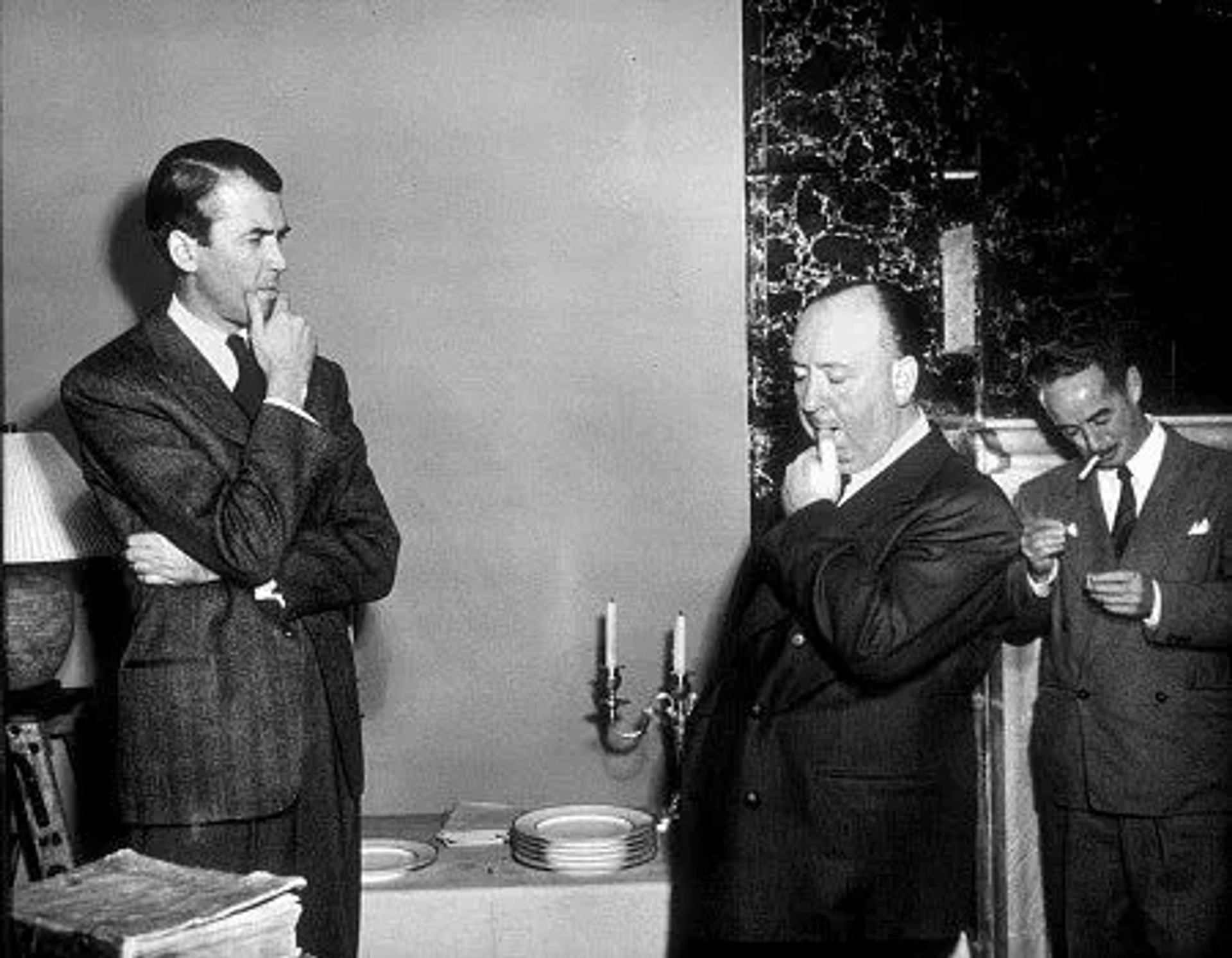 Alfred Hitchcock on teh set of "Rope" wit J. Stewart. 1948 Warner Bros.