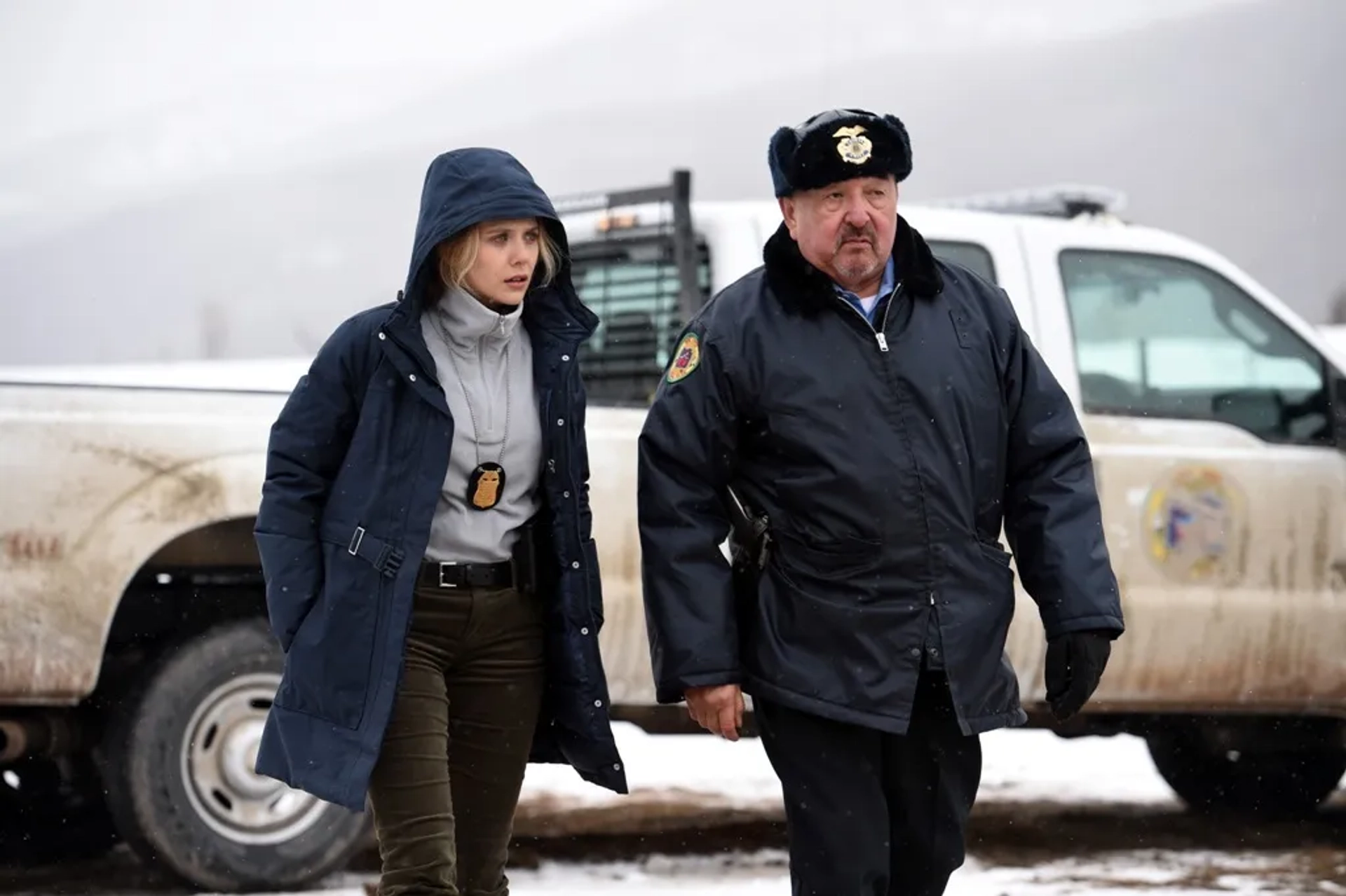 Graham Greene and Elizabeth Olsen in Wind River (2017)