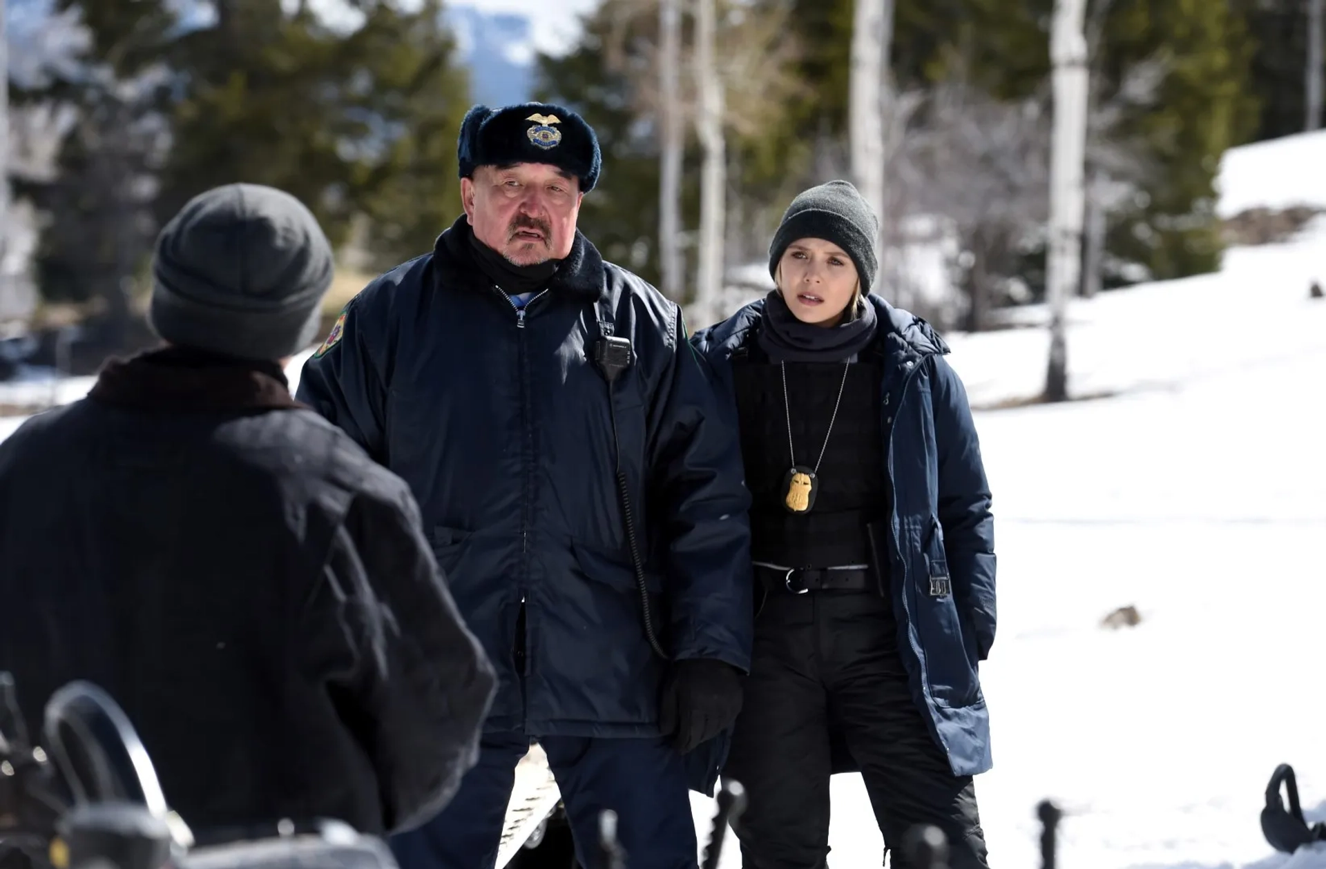 Graham Greene and Elizabeth Olsen in Wind River (2017)