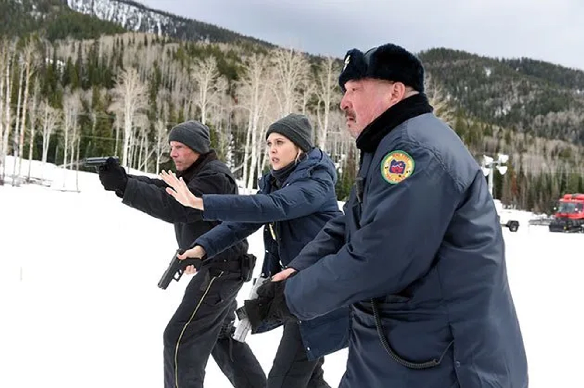 Graham Greene, Hugh Dillon, and Elizabeth Olsen in Wind River (2017)