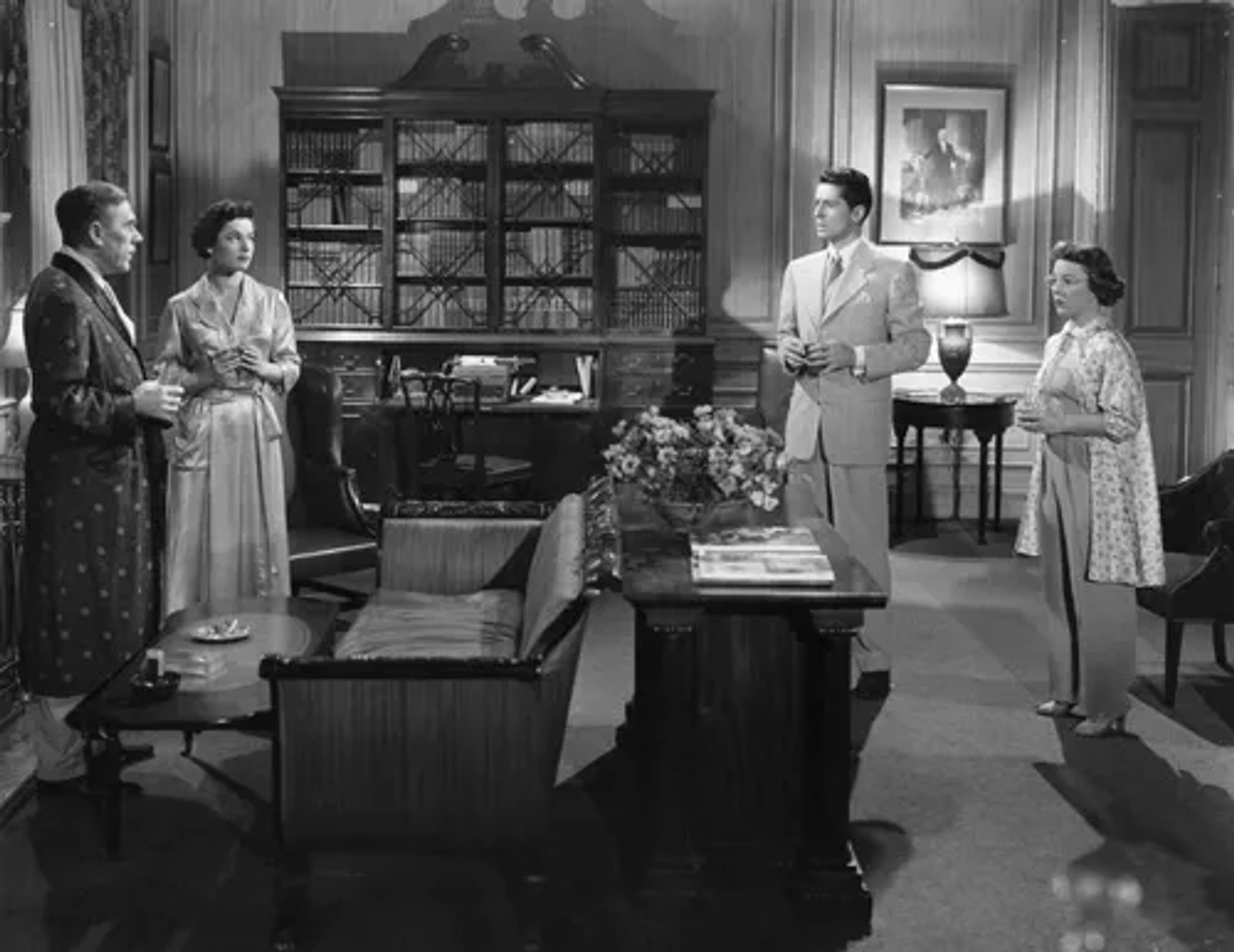 Leo G. Carroll, Farley Granger, Patricia Hitchcock, and Ruth Roman in Strangers on a Train (1951)