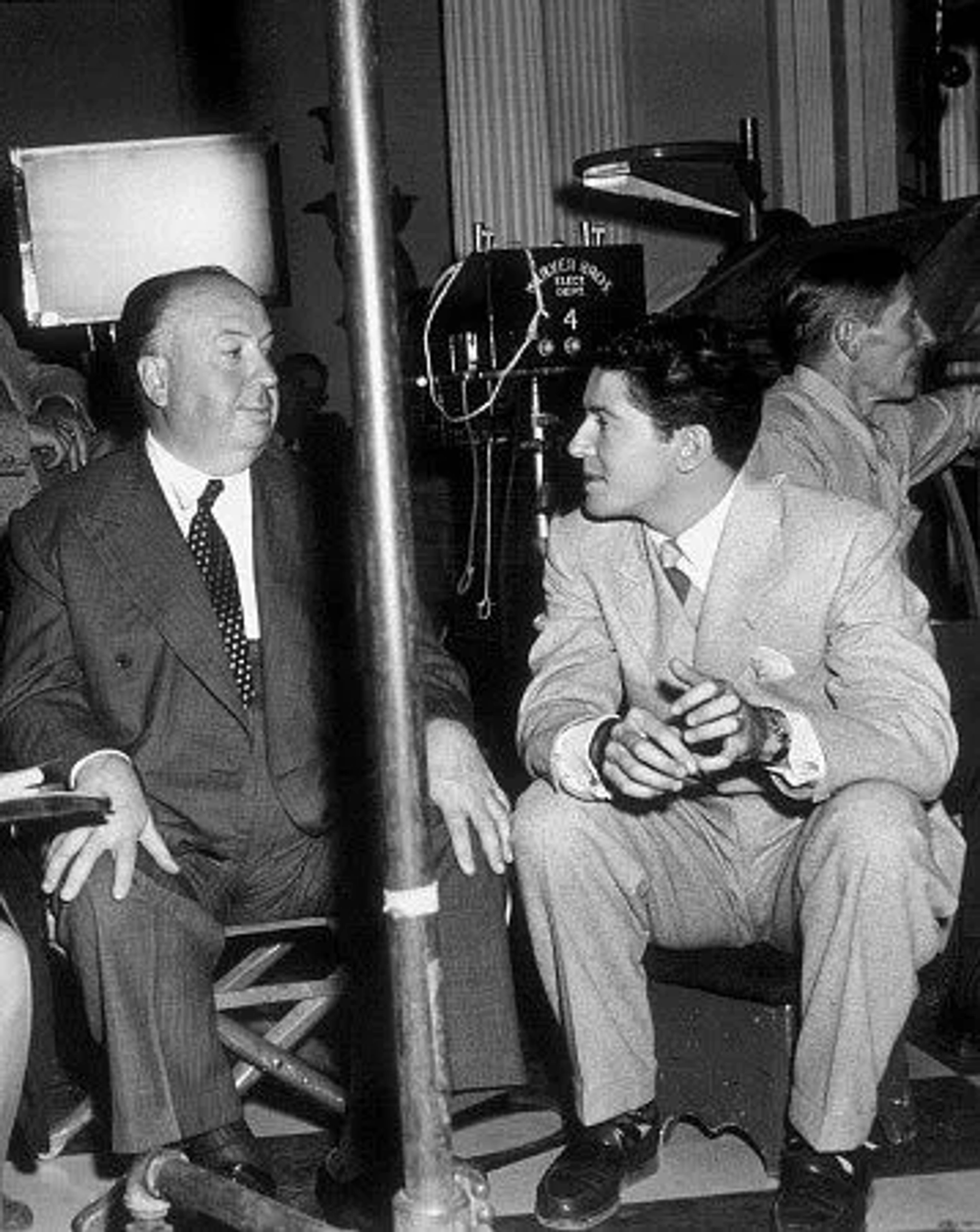 Alfred Hitchcock behind the scenes with Farley Granger for "Strangers On A Train." 1951 Warner