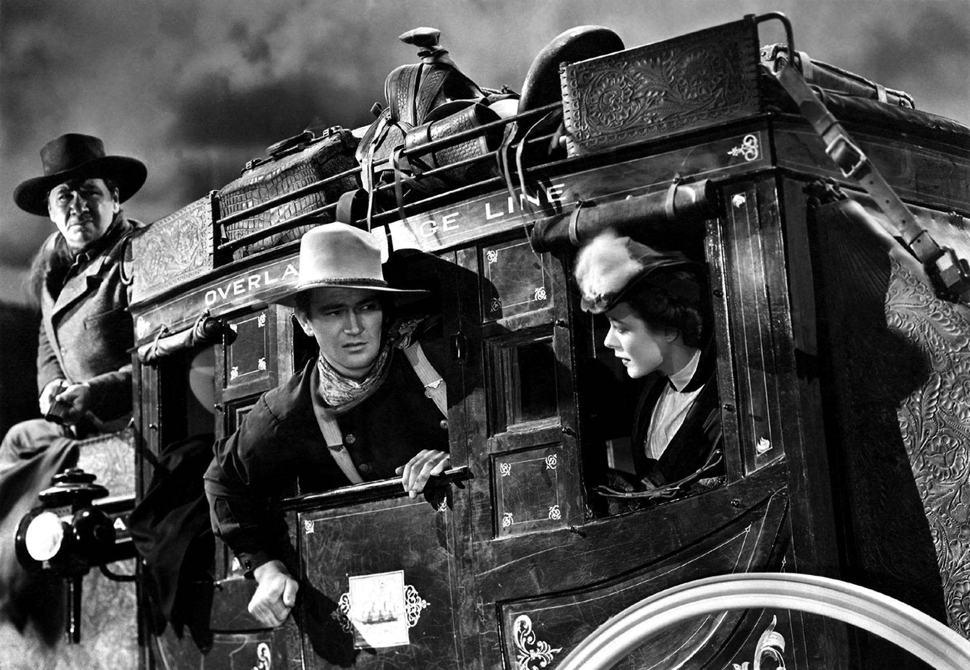 John Wayne, George Bancroft, and Louise Platt in Stagecoach (1939)