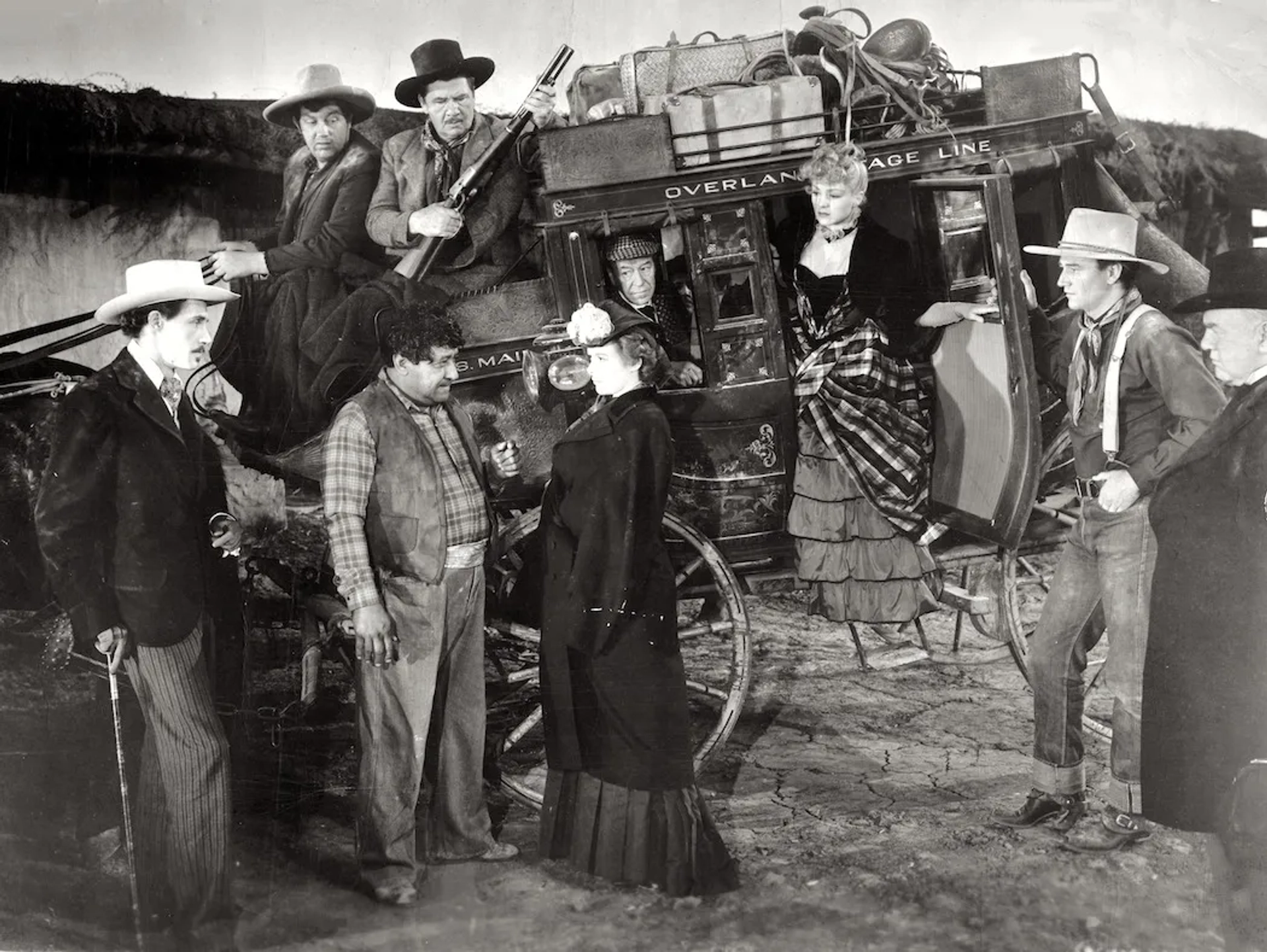 John Wayne, John Carradine, George Bancroft, Berton Churchill, Andy Devine, Chris-Pin Martin, Donald Meek, Louise Platt, and Claire Trevor in Stagecoach (1939)