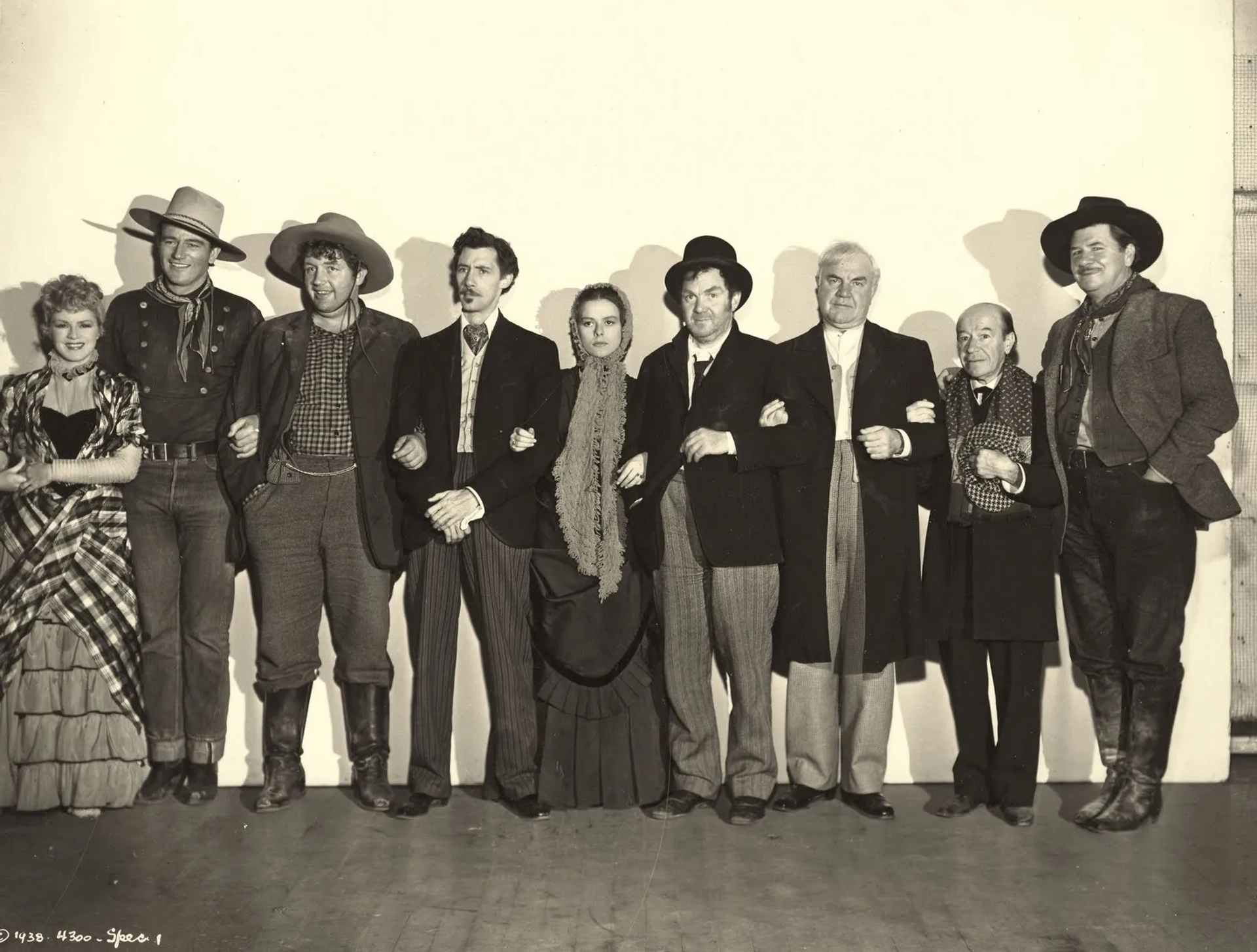 John Wayne, John Carradine, George Bancroft, Berton Churchill, Andy Devine, Donald Meek, Thomas Mitchell, Louise Platt, and Claire Trevor in Stagecoach (1939)