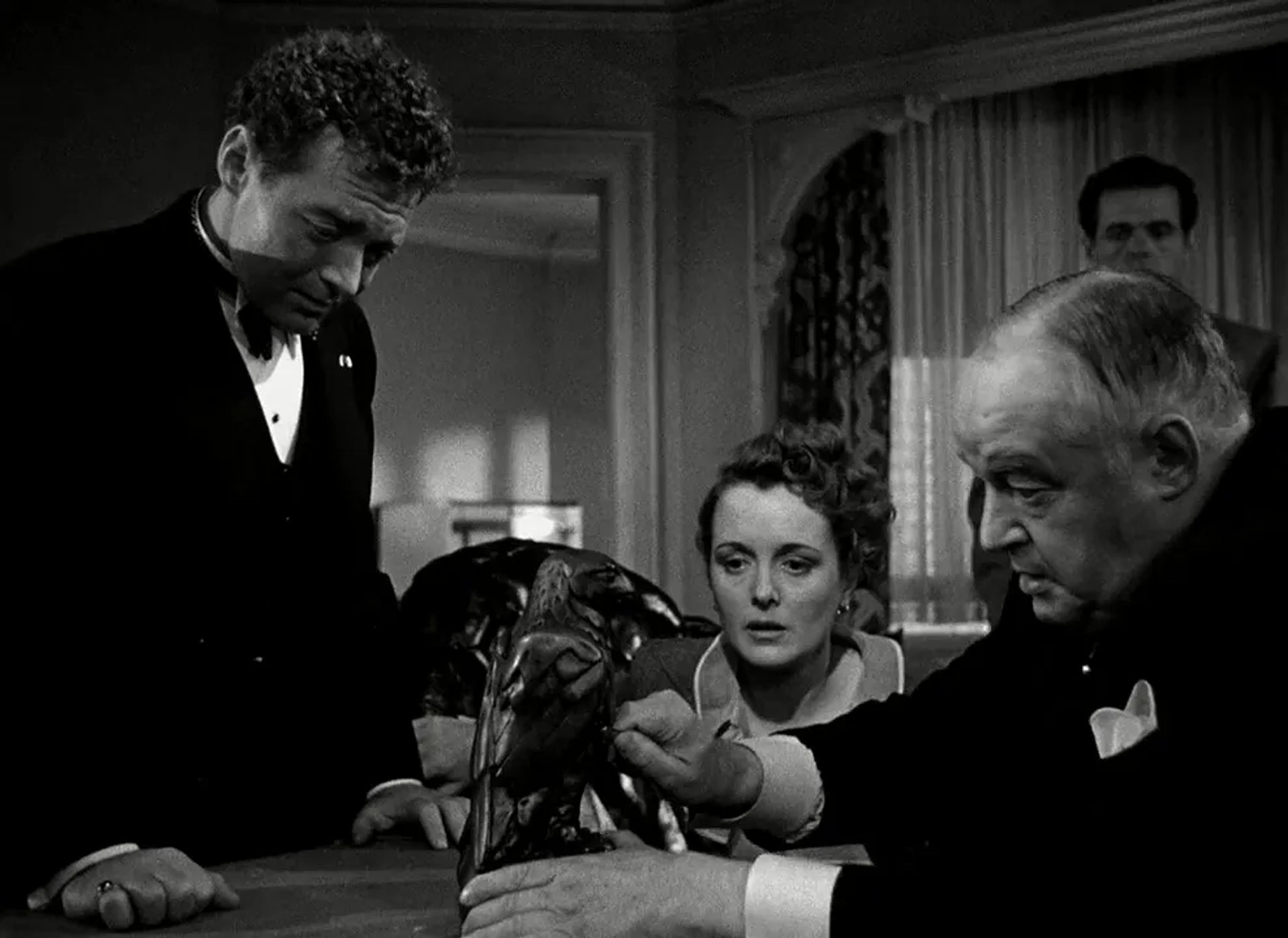 Peter Lorre, Mary Astor, Sydney Greenstreet, and Elisha Cook Jr. in The Maltese Falcon (1941)