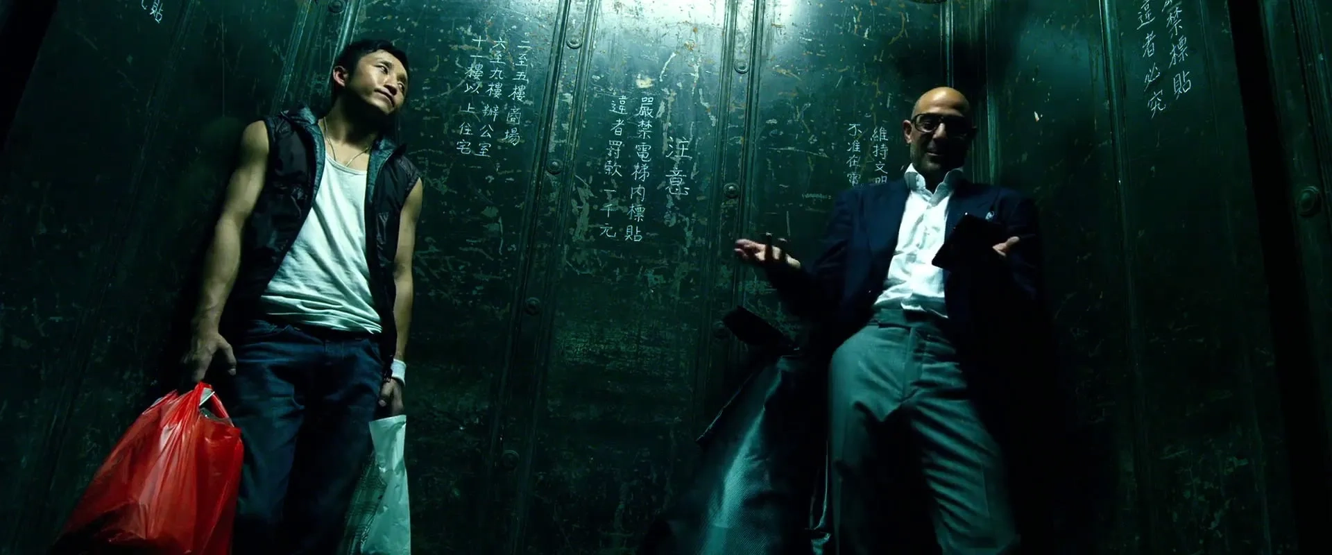 Stanley Tucci and Shiming Zou in Transformers: Age of Extinction (2014)