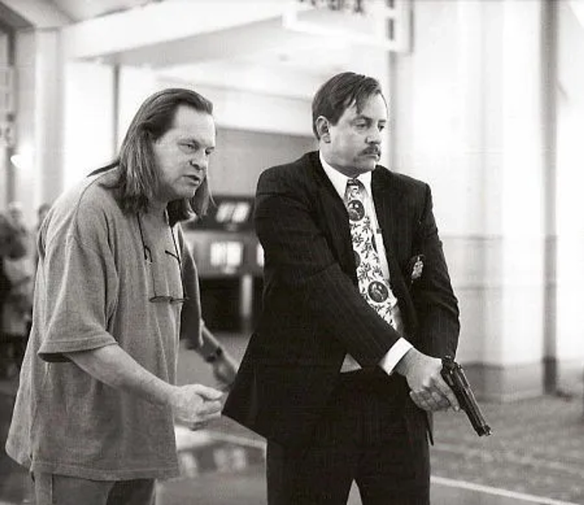 "12 Monkeys" director Terry Gilliam stages Bruce Willis' death with airport detective Stephen Bridgewater.