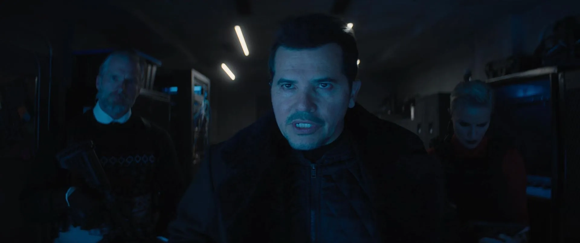 John Leguizamo, André Eriksen, and Mitra Suri in Violent Night (2022)