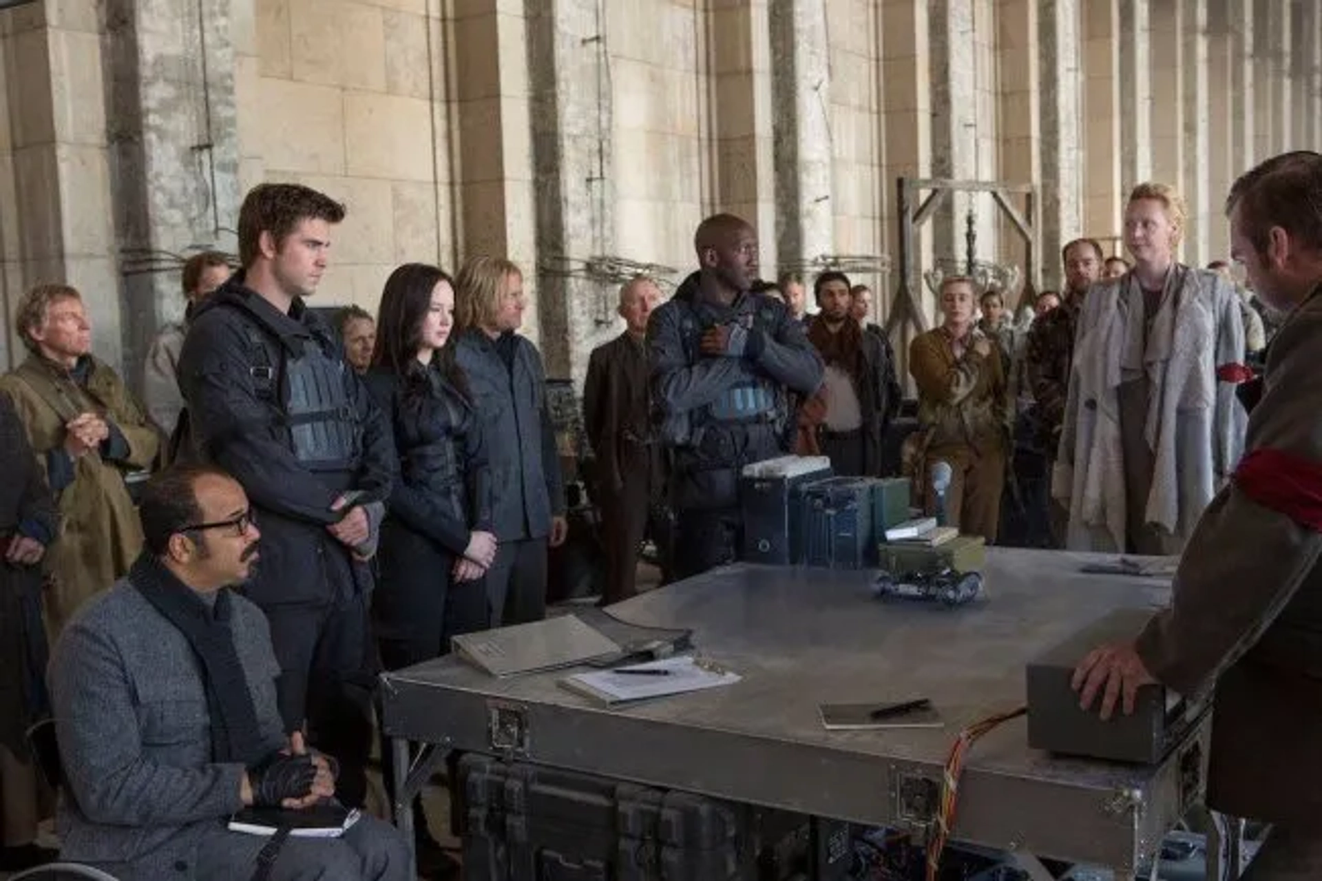 Woody Harrelson, Jeffrey Wright, Mahershala Ali, Jennifer Lawrence, Desmond Phillips, Liam Hemsworth, and Gwendoline Christie in The Hunger Games: Mockingjay - Part 2 (2015)