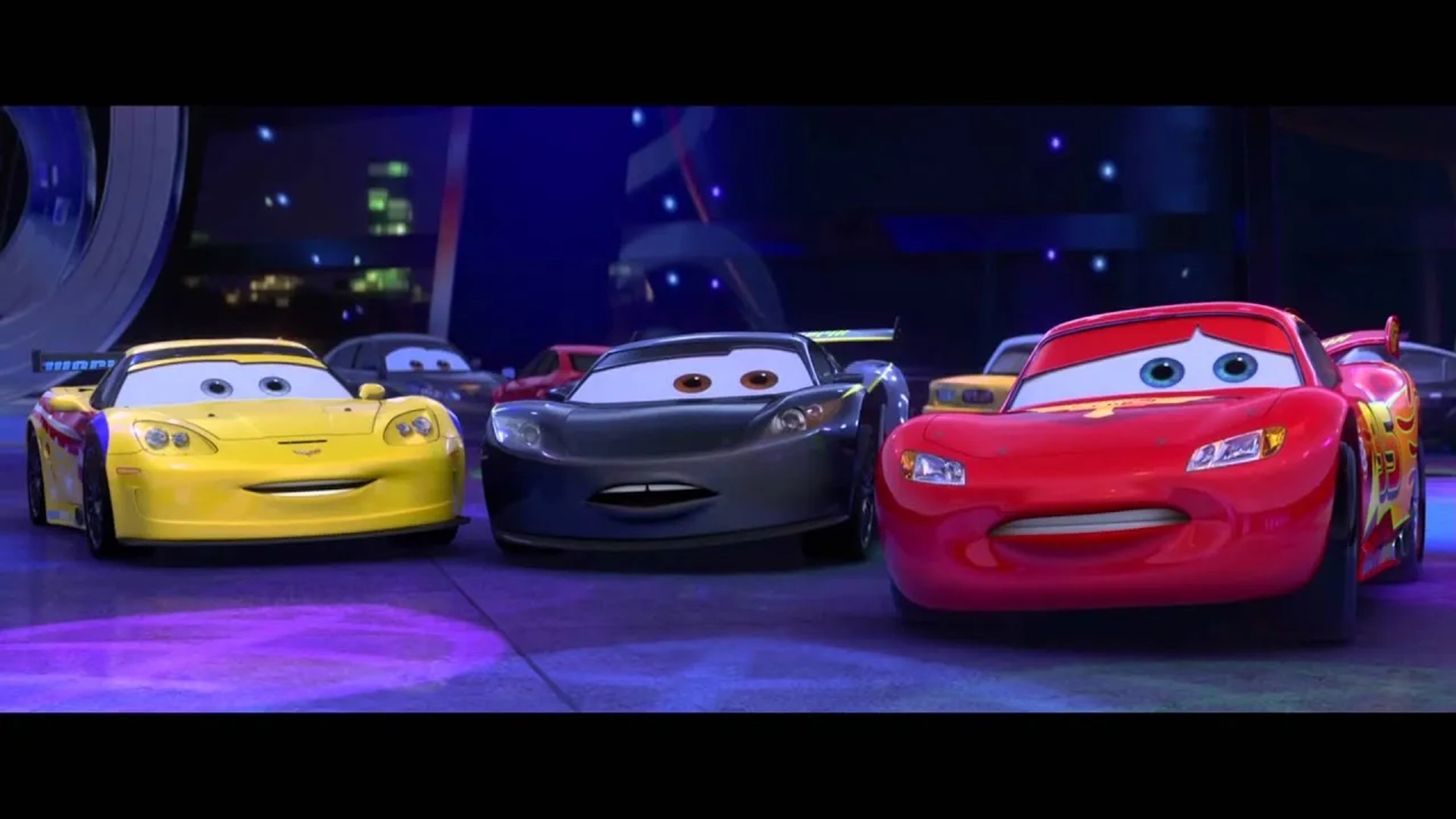 Owen Wilson, Jeff Gordon, and Lewis Hamilton in Cars 2 (2011)