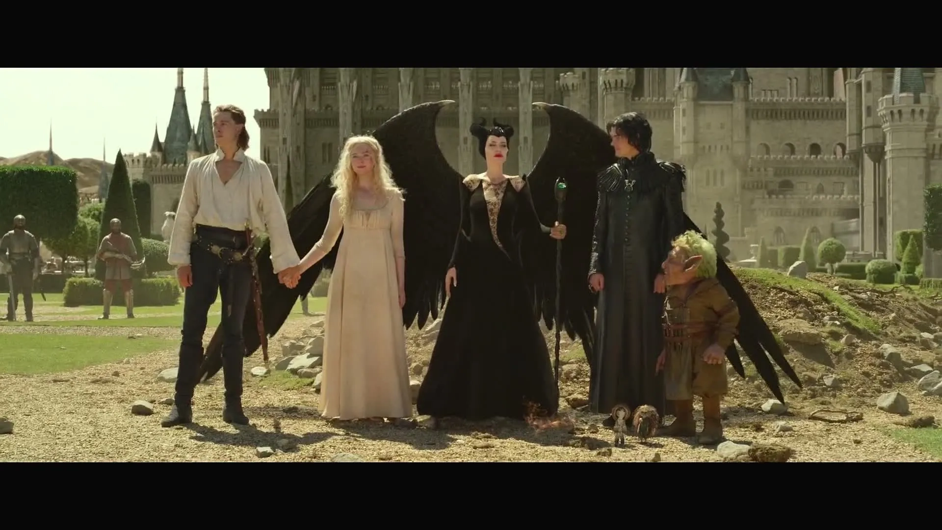 Warwick Davis, Angelina Jolie, Sam Riley, Elle Fanning, and Harris Dickinson in Maleficent: Mistress of Evil (2019)