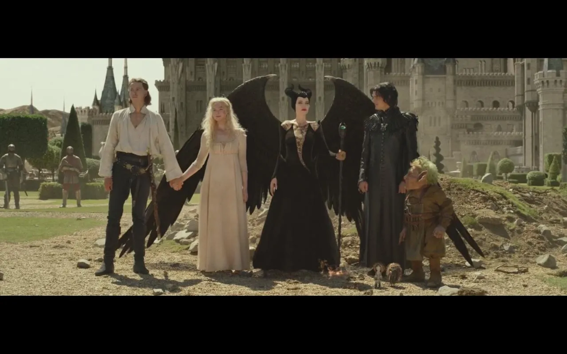 Warwick Davis, Angelina Jolie, Sam Riley, Elle Fanning, and Harris Dickinson in Maleficent: Mistress of Evil (2019)