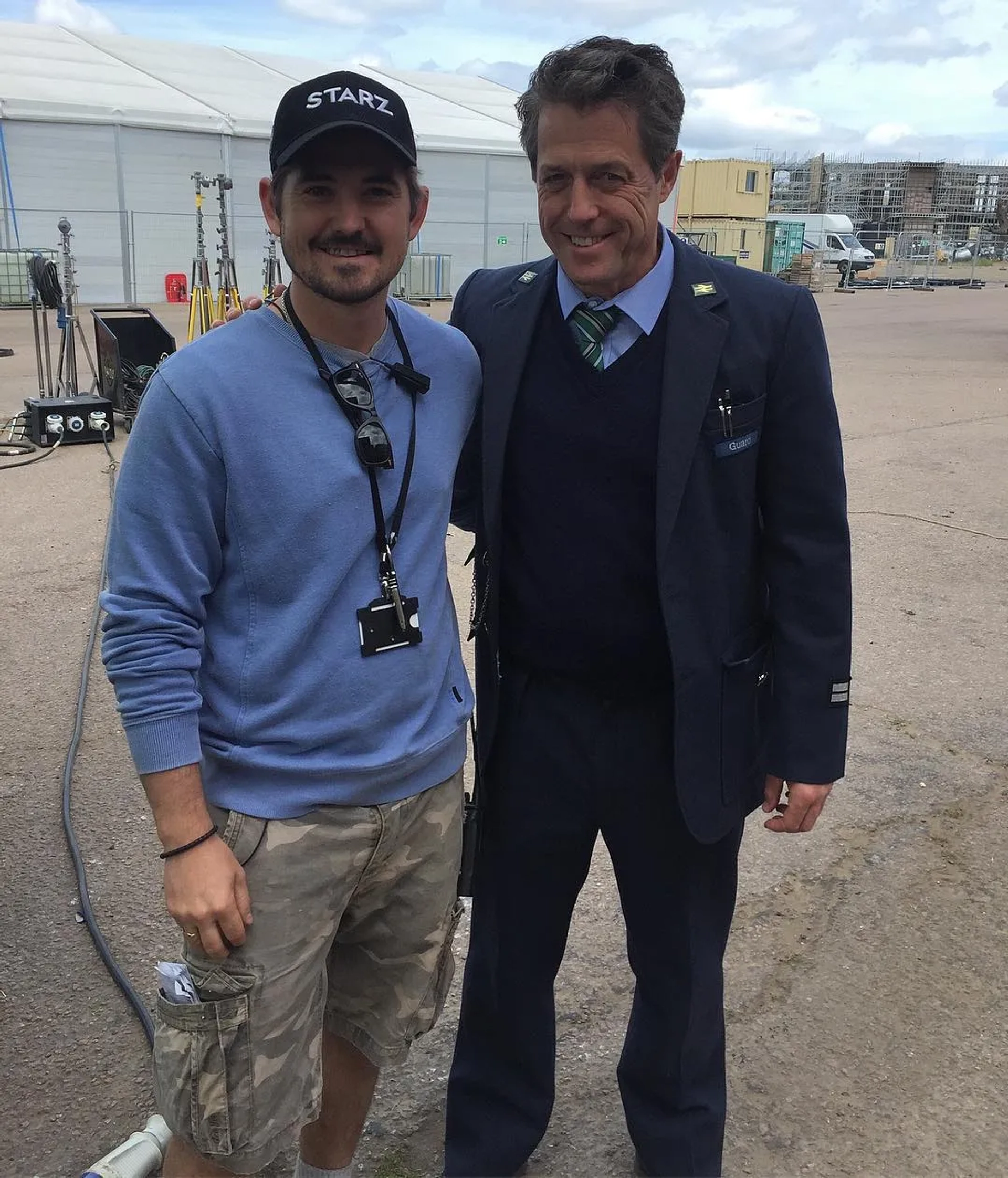 Hugh Grant and John Farrall-Miles in Paddington 2 (2017)