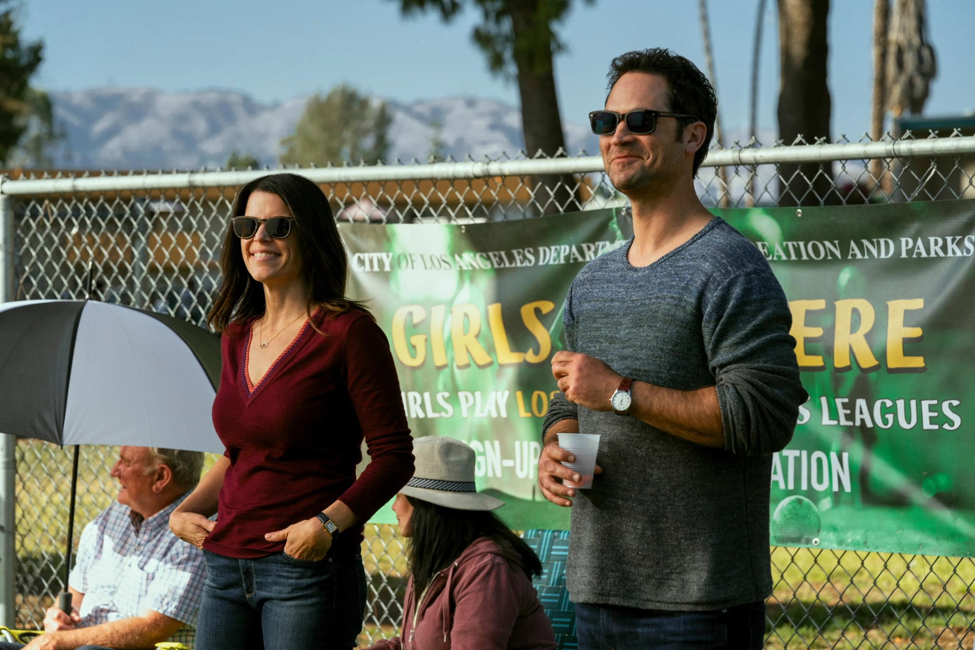 Neve Campbell and Manuel Garcia-Rulfo in The Lincoln Lawyer (2022)