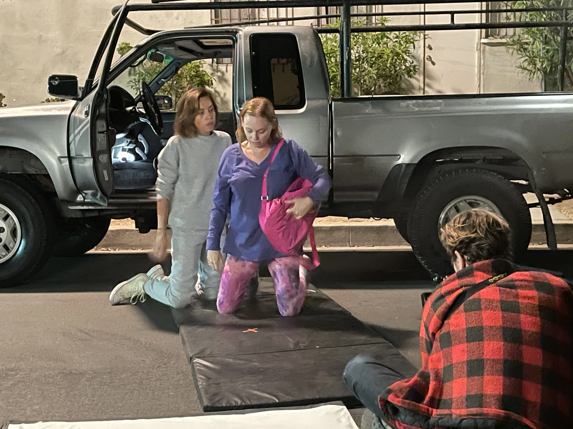 Aubrey Plaza and Sarah Allyn Bauer prepare for scene outside of truck.