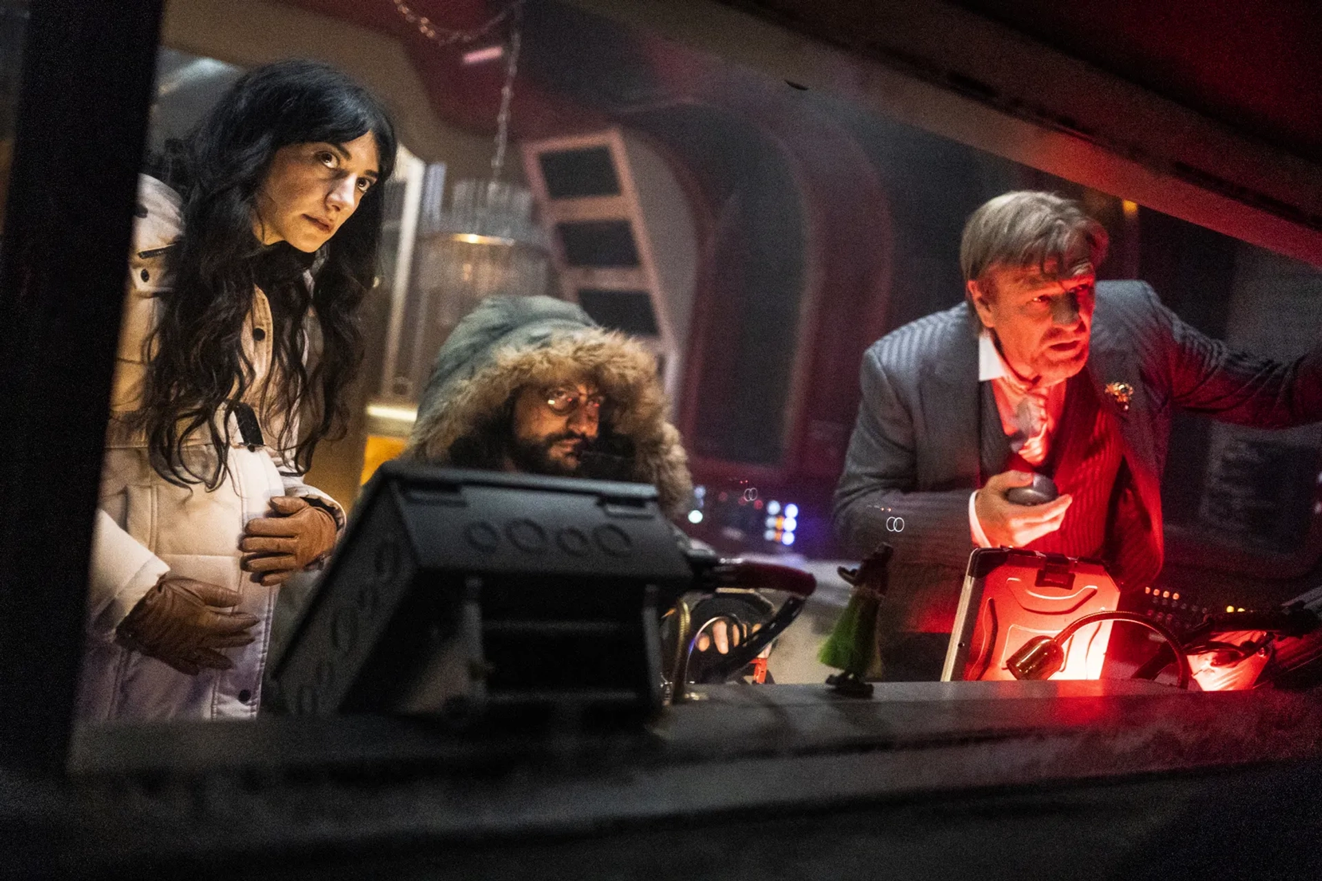 Sean Bean, Roberto Urbina, and Sheila Vand in Snowpiercer: The First Blow (2022)