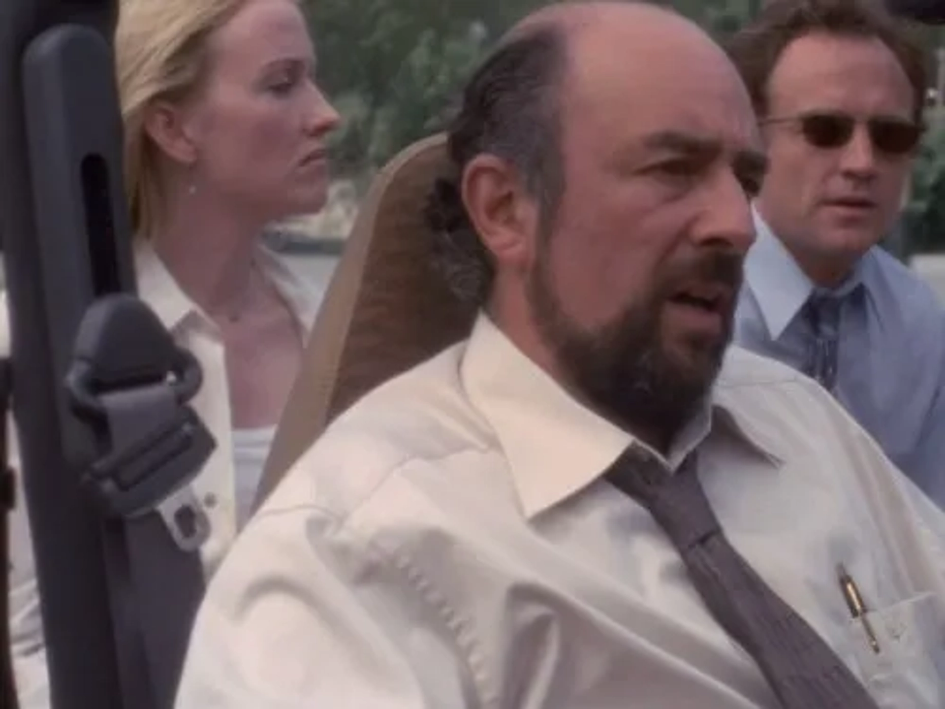 Janel Moloney, Richard Schiff, and Bradley Whitford in The West Wing (1999)