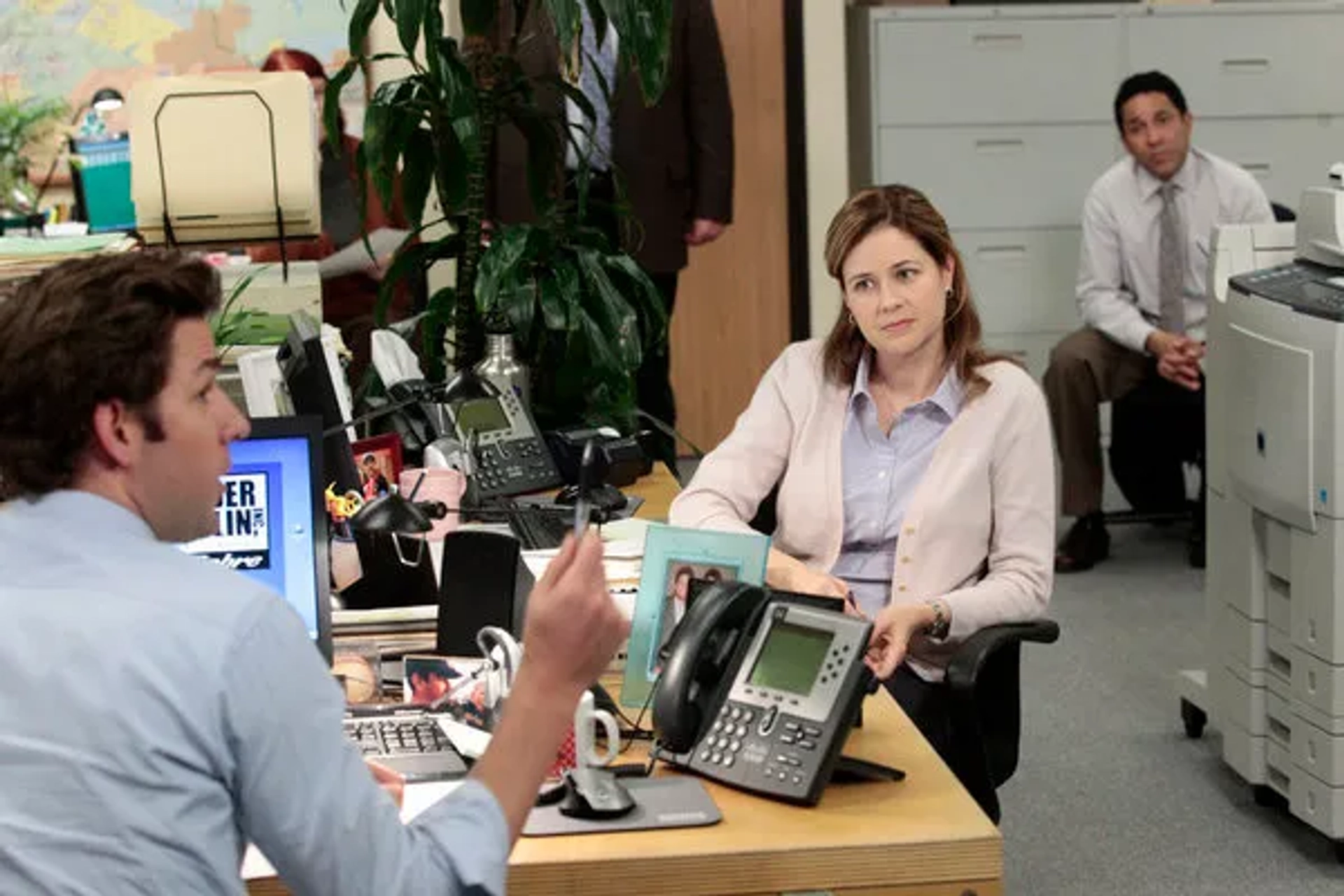 Jenna Fischer, John Krasinski, and Oscar Nuñez in The Office (2005)