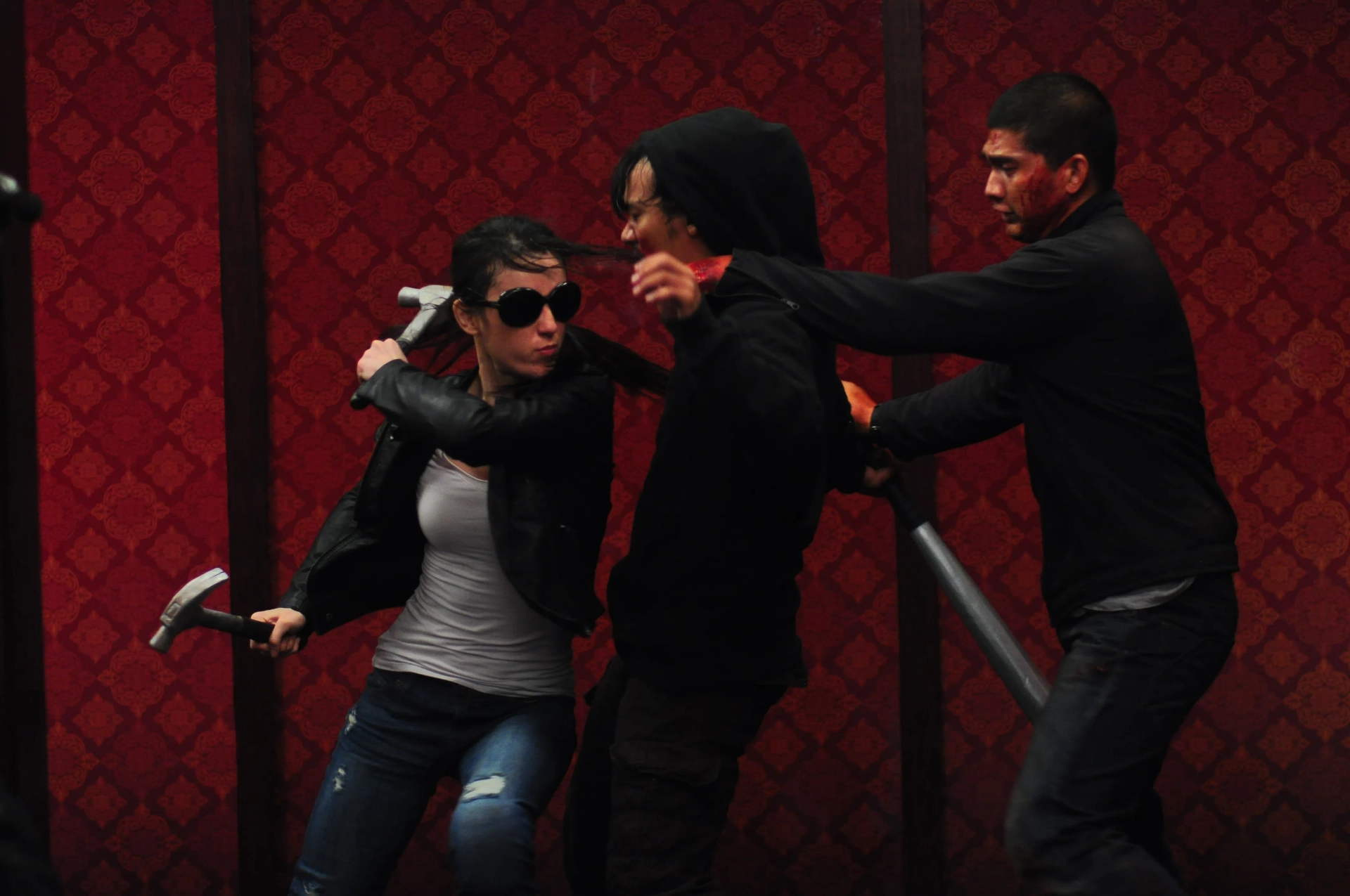 Julie Estelle, Iko Uwais, and Very Tri Yulisman in The Raid 2 (2014)