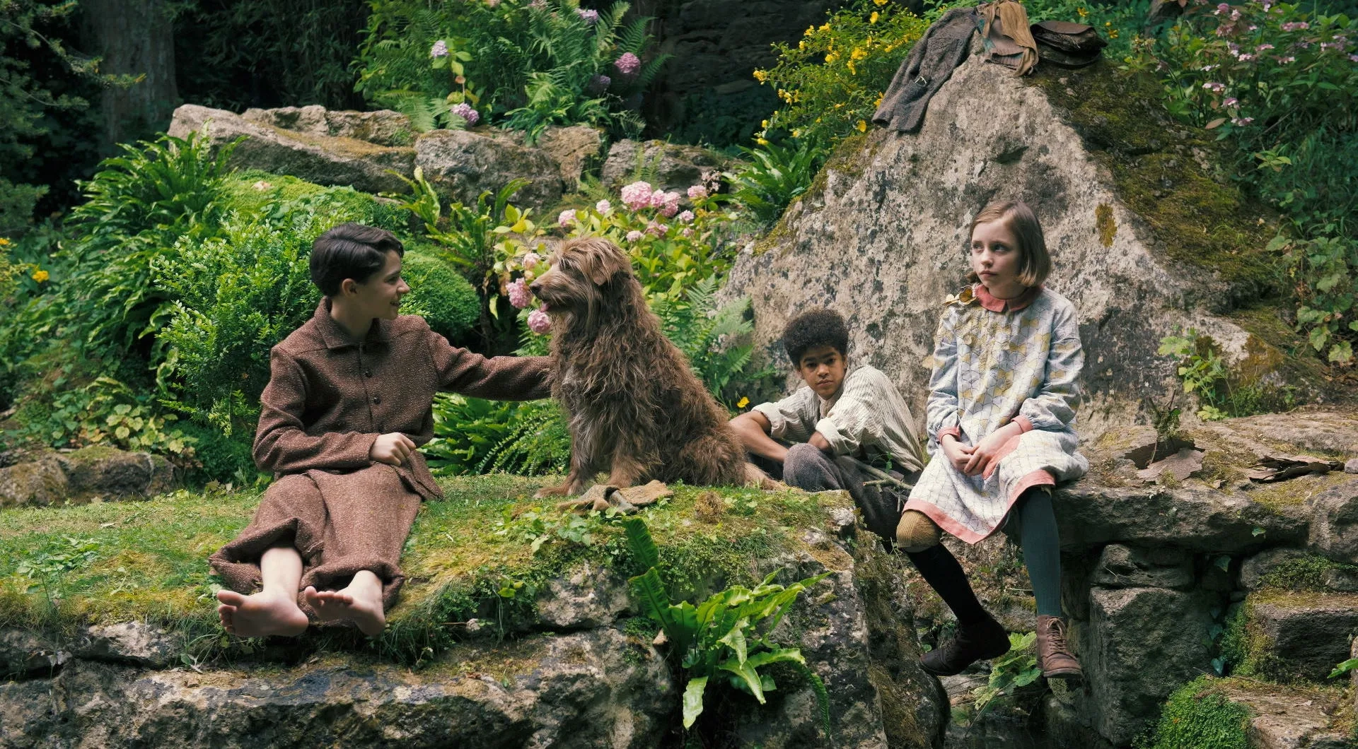 Dixie Egerickx, Edan Hayhurst, and Amir Wilson in The Secret Garden (2020)