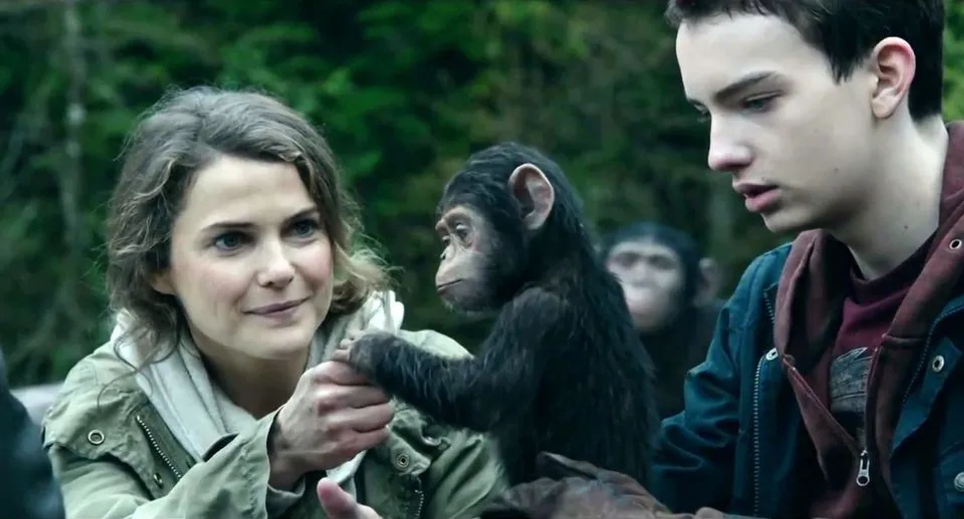 Keri Russell and Kodi Smit-McPhee in Dawn of the Planet of the Apes (2014)