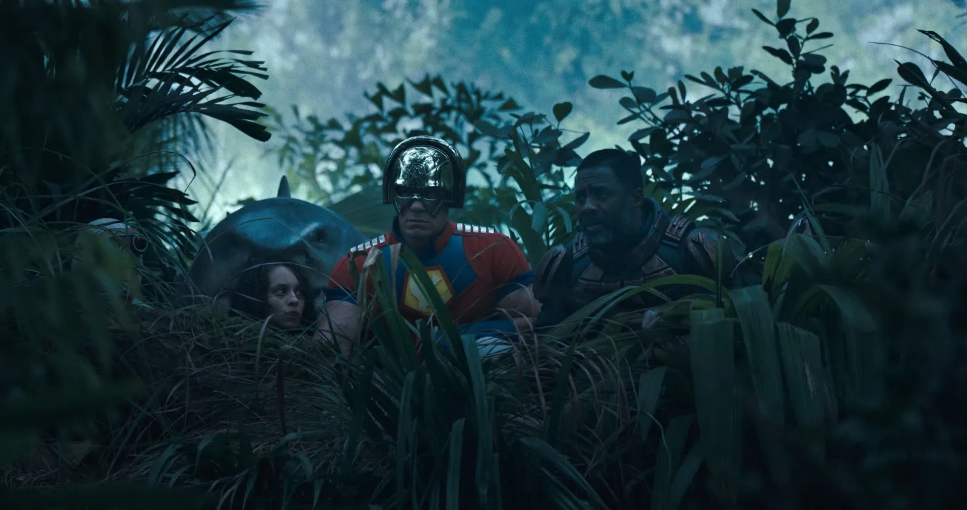 Idris Elba, John Cena, and Daniela Melchior in The Suicide Squad (2021)