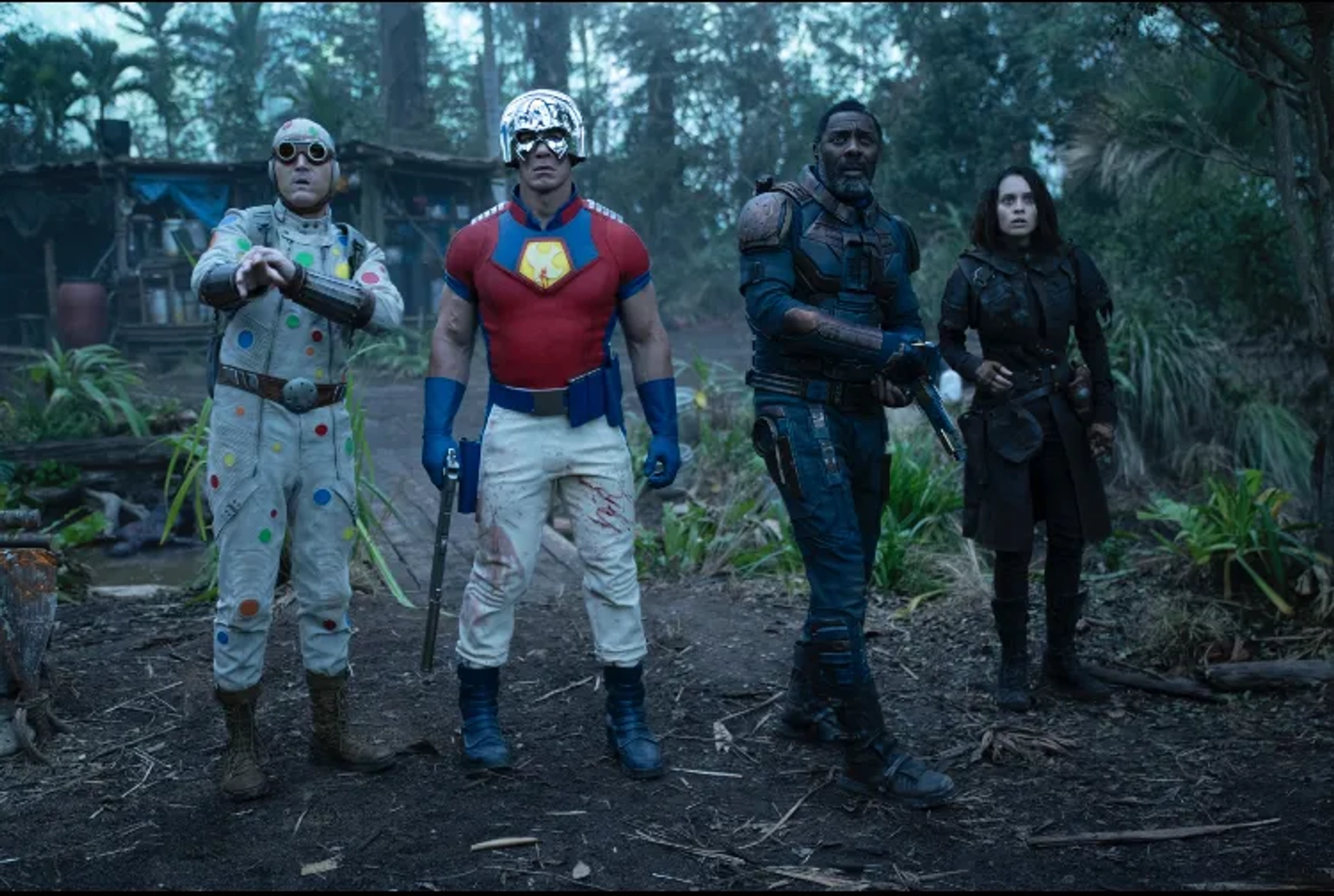 Idris Elba, John Cena, Mikaela Hoover, and David Dastmalchian in The Suicide Squad (2021)