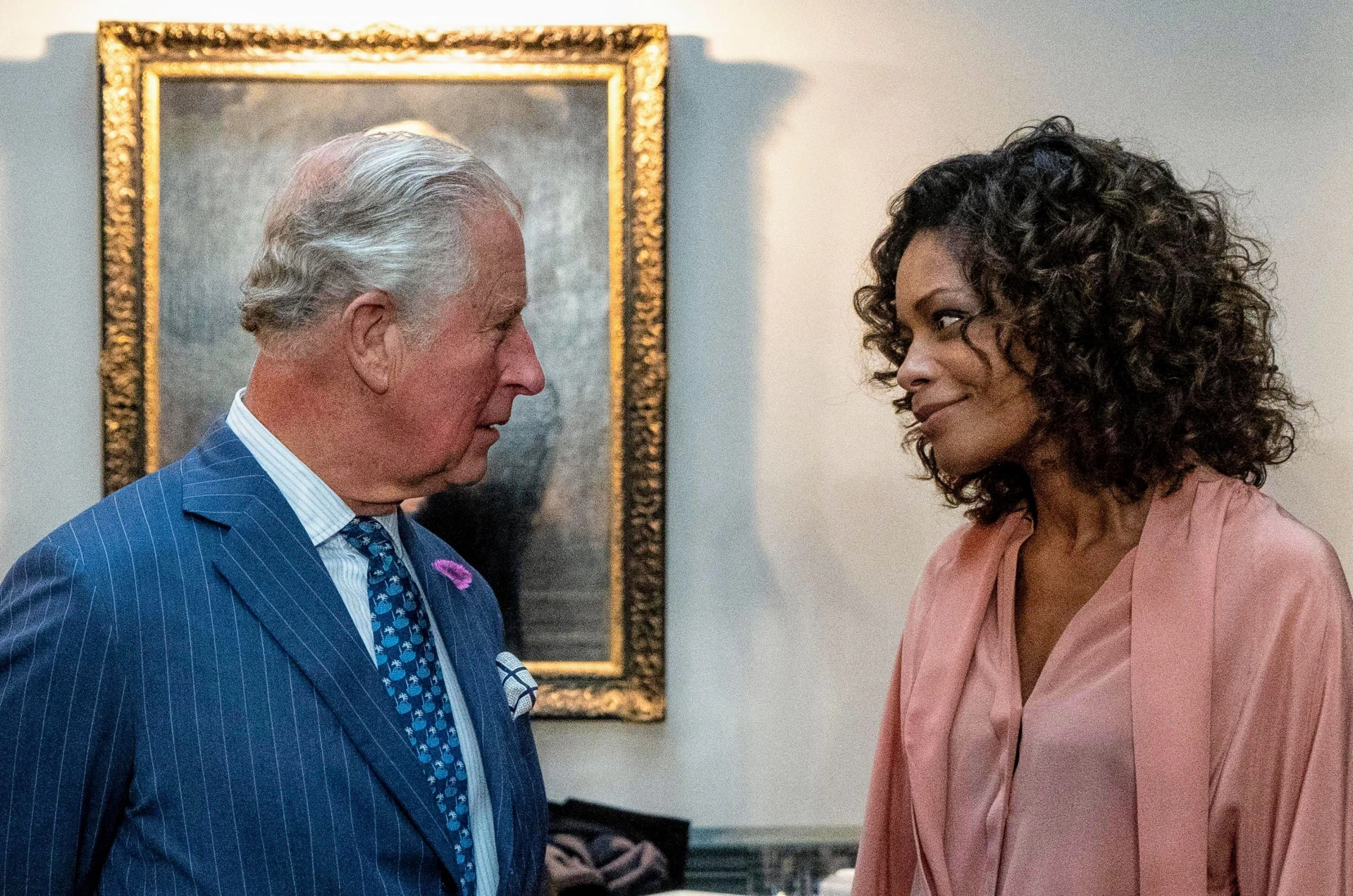 Naomie Harris and King Charles III in No Time to Die (2021)