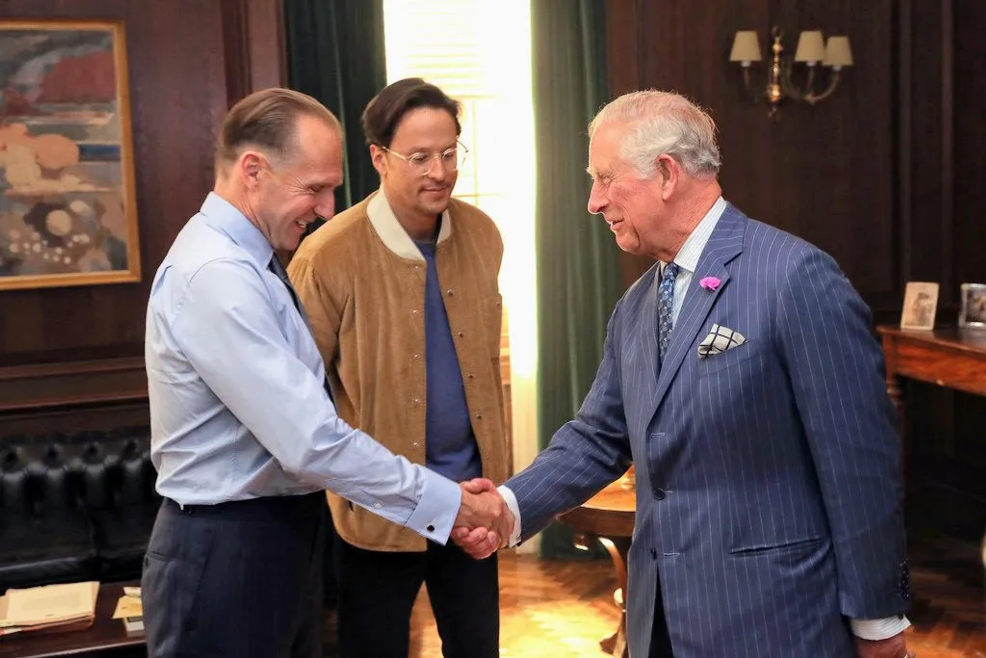 Ralph Fiennes, King Charles III, and Cary Joji Fukunaga in No Time to Die (2021)