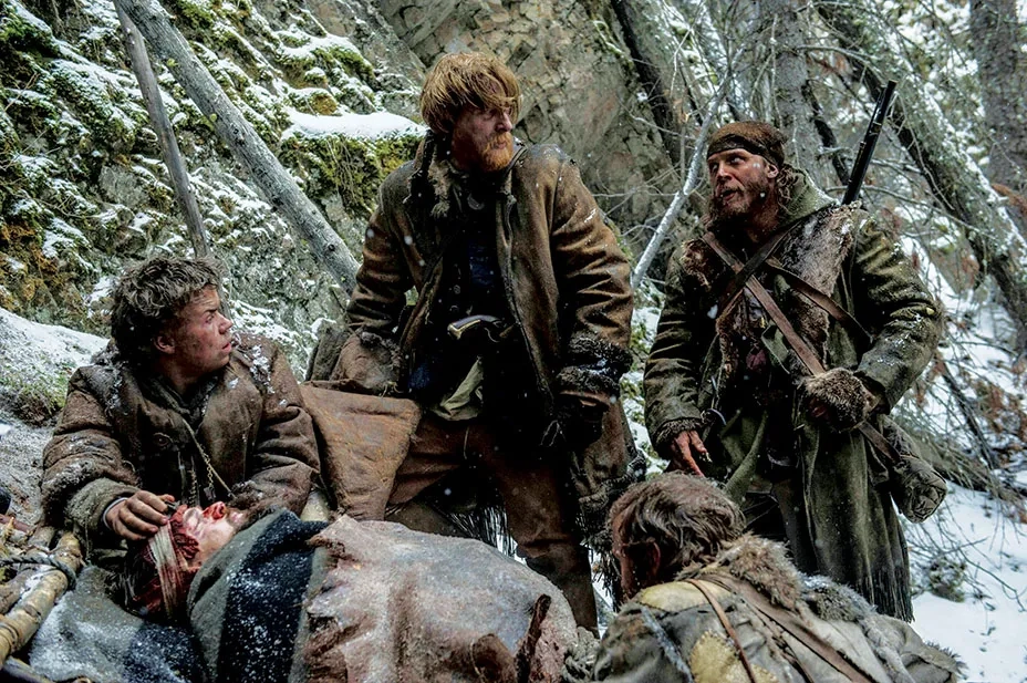 Leonardo DiCaprio, Tom Hardy, Domhnall Gleeson, and Will Poulter in The Revenant (2015)