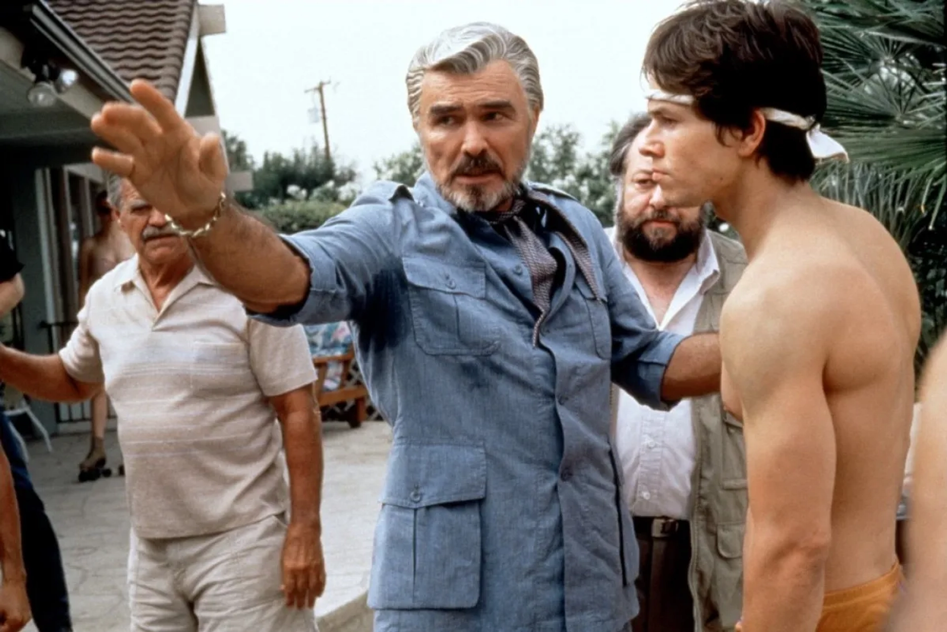 Mark Wahlberg, Burt Reynolds, Ricky Jay, and Jack Wallace in Boogie Nights (1997)