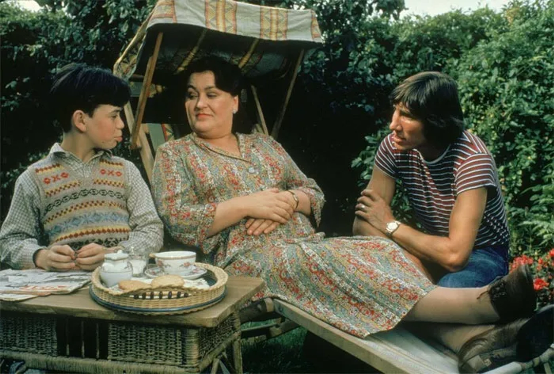 Christine Hargreaves, Kevin McKeon, and Roger Waters in Pink Floyd: The Wall (1982)