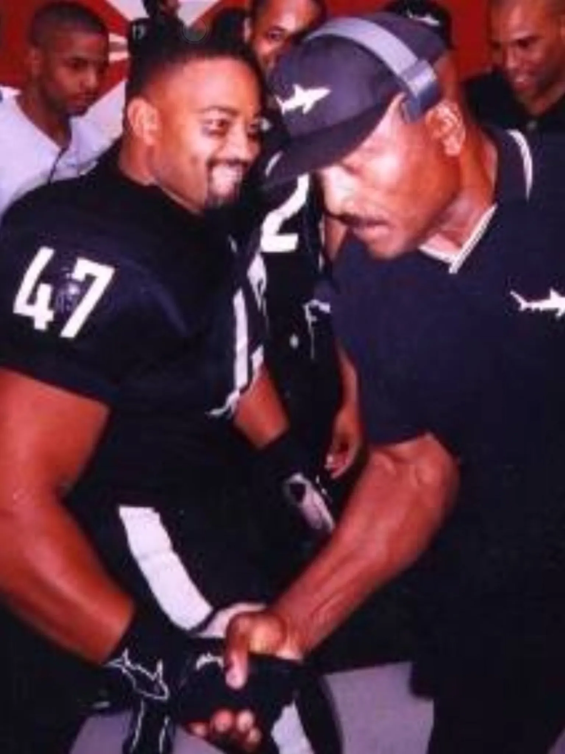 Dennis and NFL Hall of Famer, Jim Brown grip wrestle. -'Any Given Sunday' film