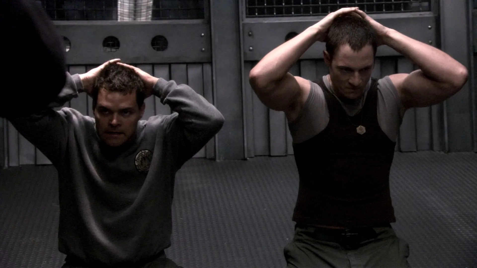 Aaron Douglas and Tahmoh Penikett in Battlestar Galactica (2004)