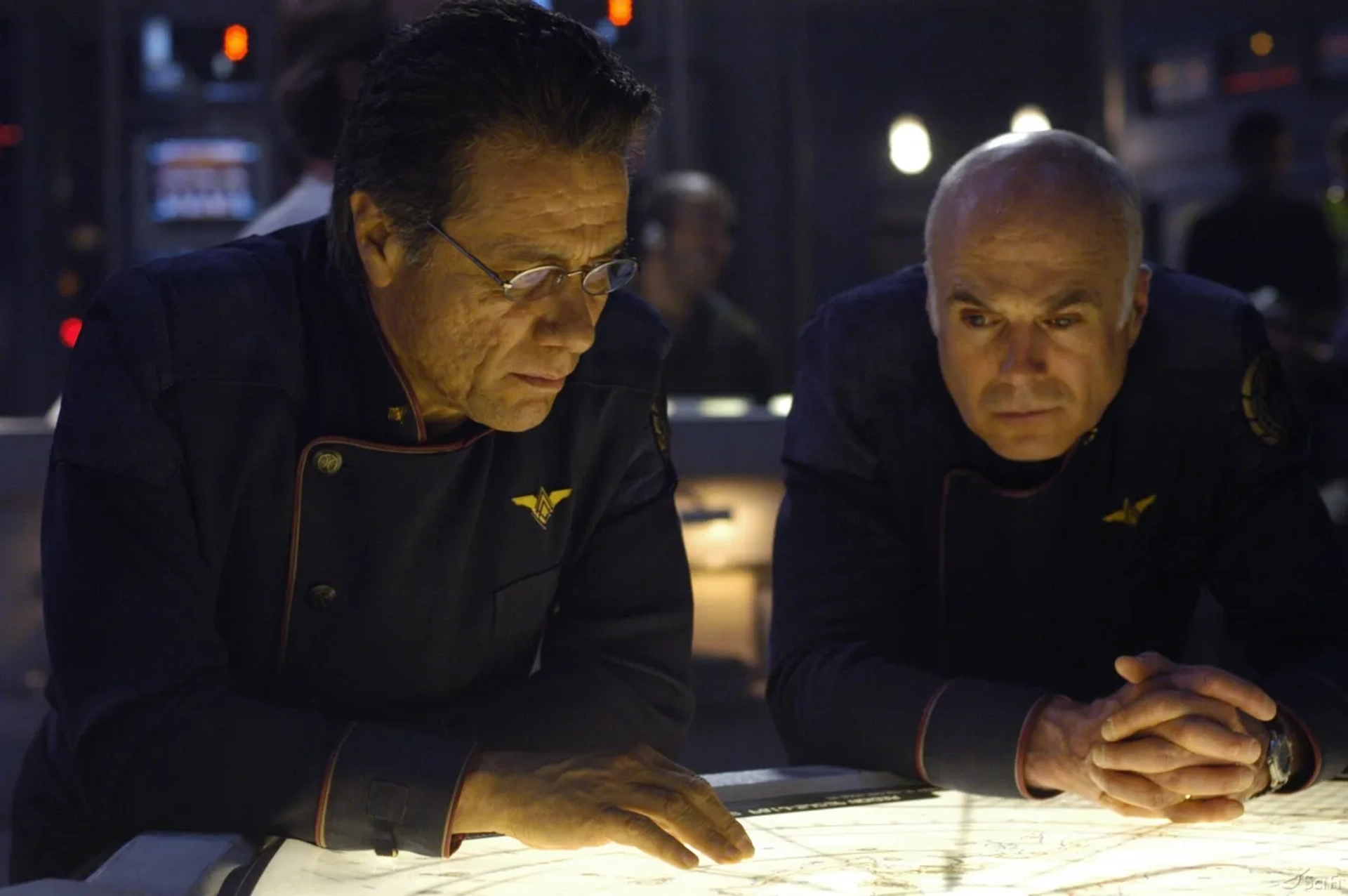 Edward James Olmos and Michael Hogan in Battlestar Galactica (2004)