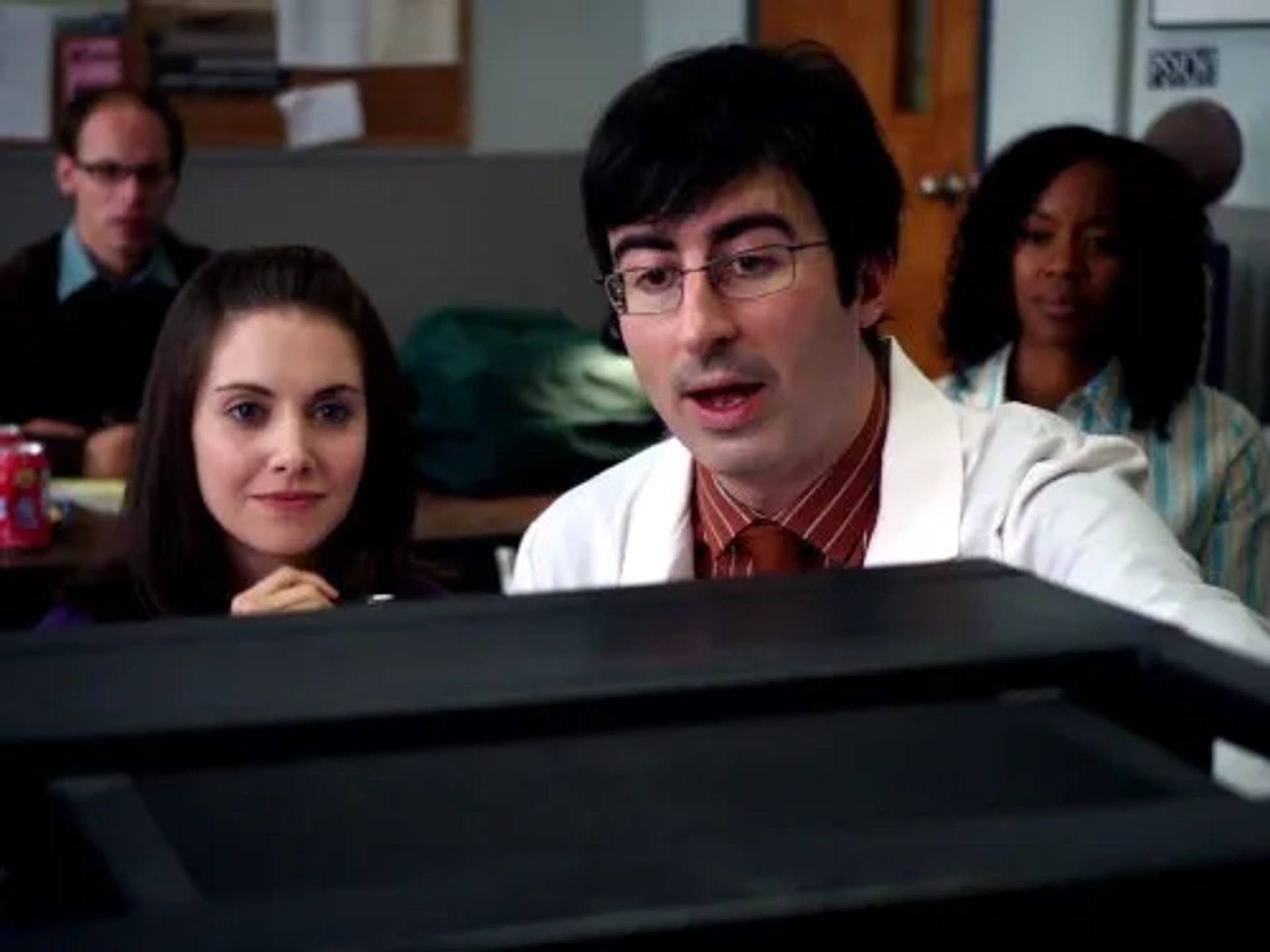 John Oliver and Alison Brie in Community (2009)