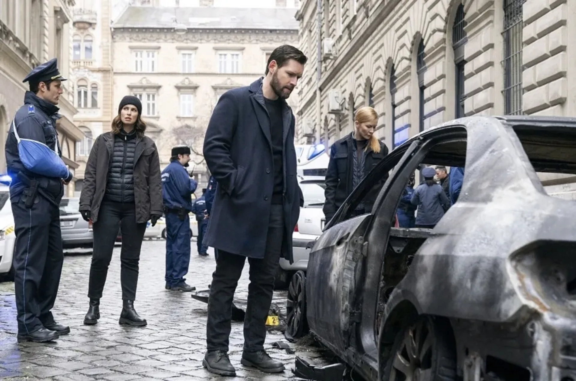 Luke Kleintank, Heida Reed, and Eva-Jane Willis in FBI: International (2021)