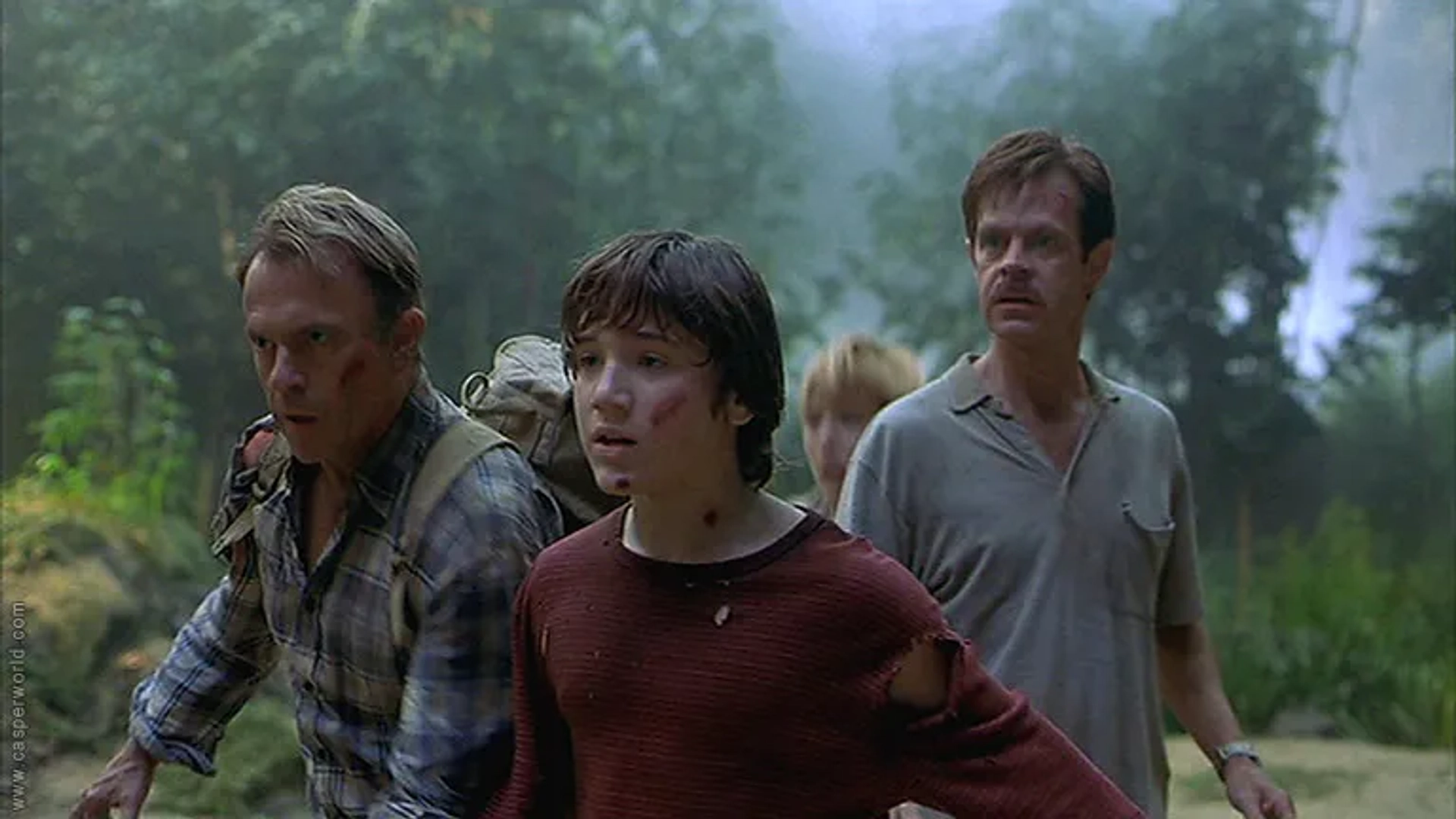 Téa Leoni, William H. Macy, Sam Neill, and Trevor Morgan in Jurassic Park III (2001)