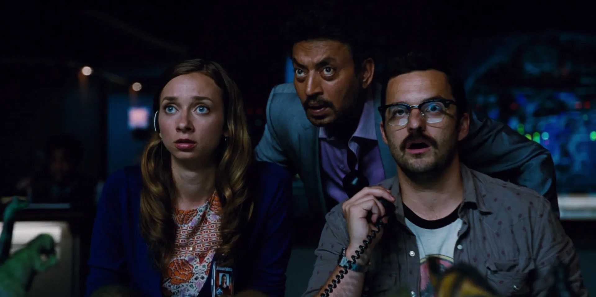 Irrfan Khan, Lauren Lapkus, and Jake Johnson in Jurassic World (2015)