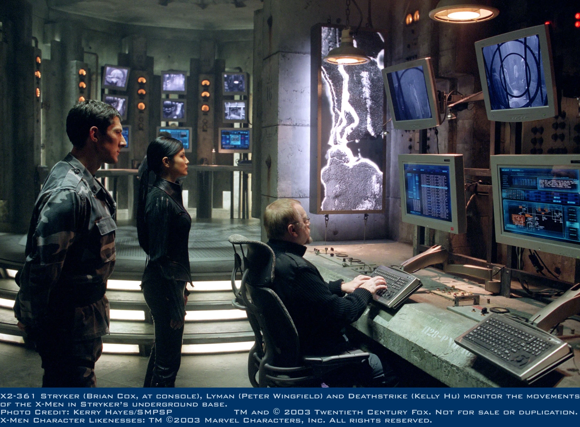 Brian Cox, Kelly Hu, and Peter Wingfield in X2 (2003)