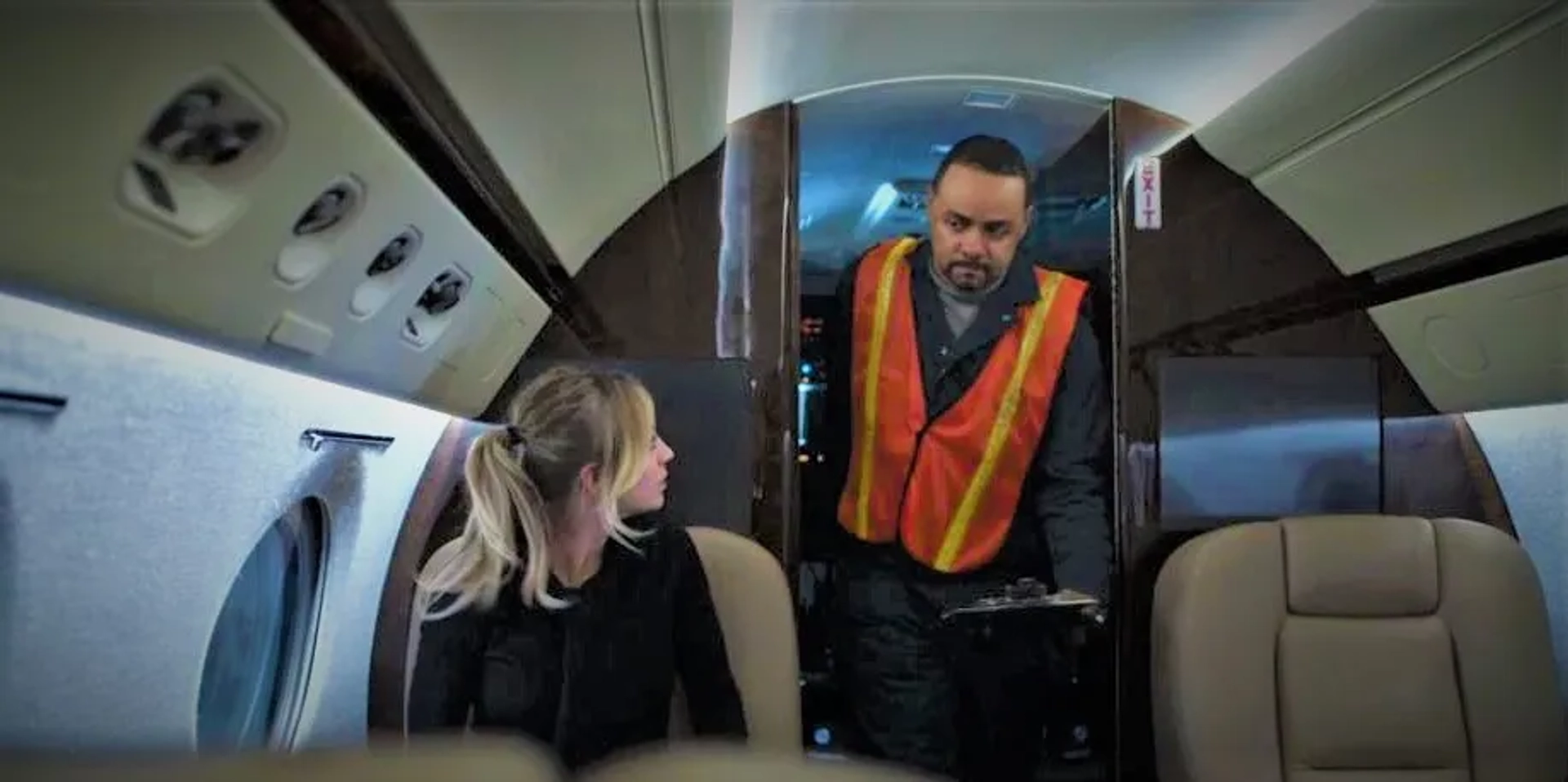 Still of Kaley Cuoco and Abraham Vasquez in The Flight Attendant and Conspiracy Theories