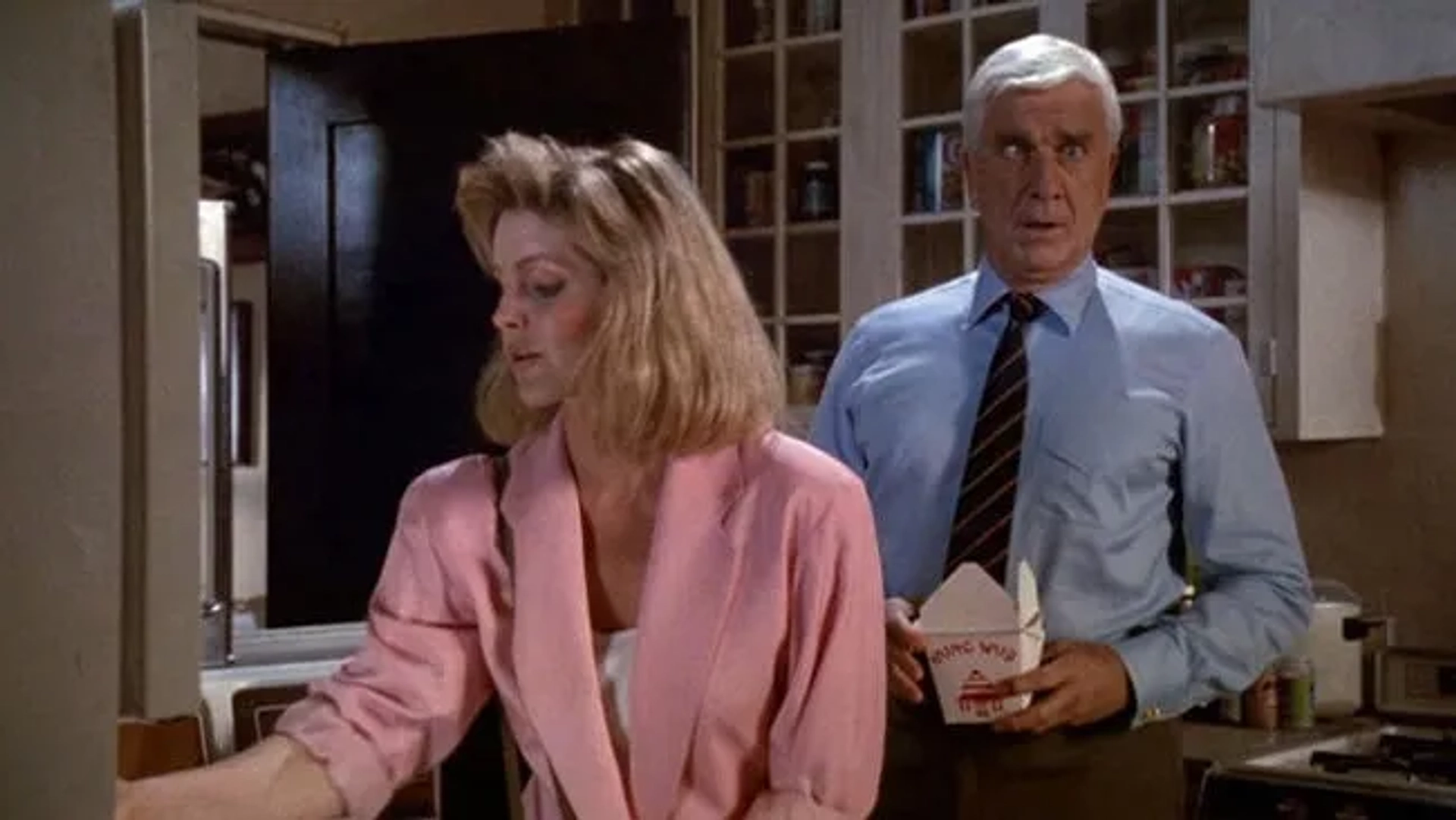 Leslie Nielsen and Priscilla Presley in The Naked Gun: From the Files of Police Squad! (1988)