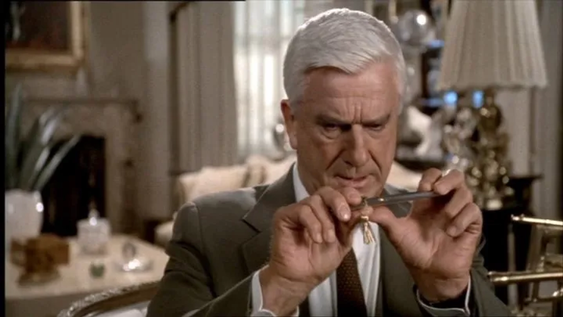 Leslie Nielsen in The Naked Gun: From the Files of Police Squad! (1988)