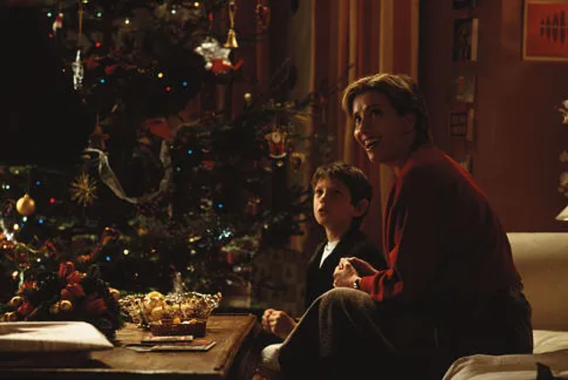 Karen (EMMA THOMPSON) and son Bernie (WILLIAM WADHAM) prepare for Christmas and all its possibilities in Richard Curtis' romantic comedy Love Actually.