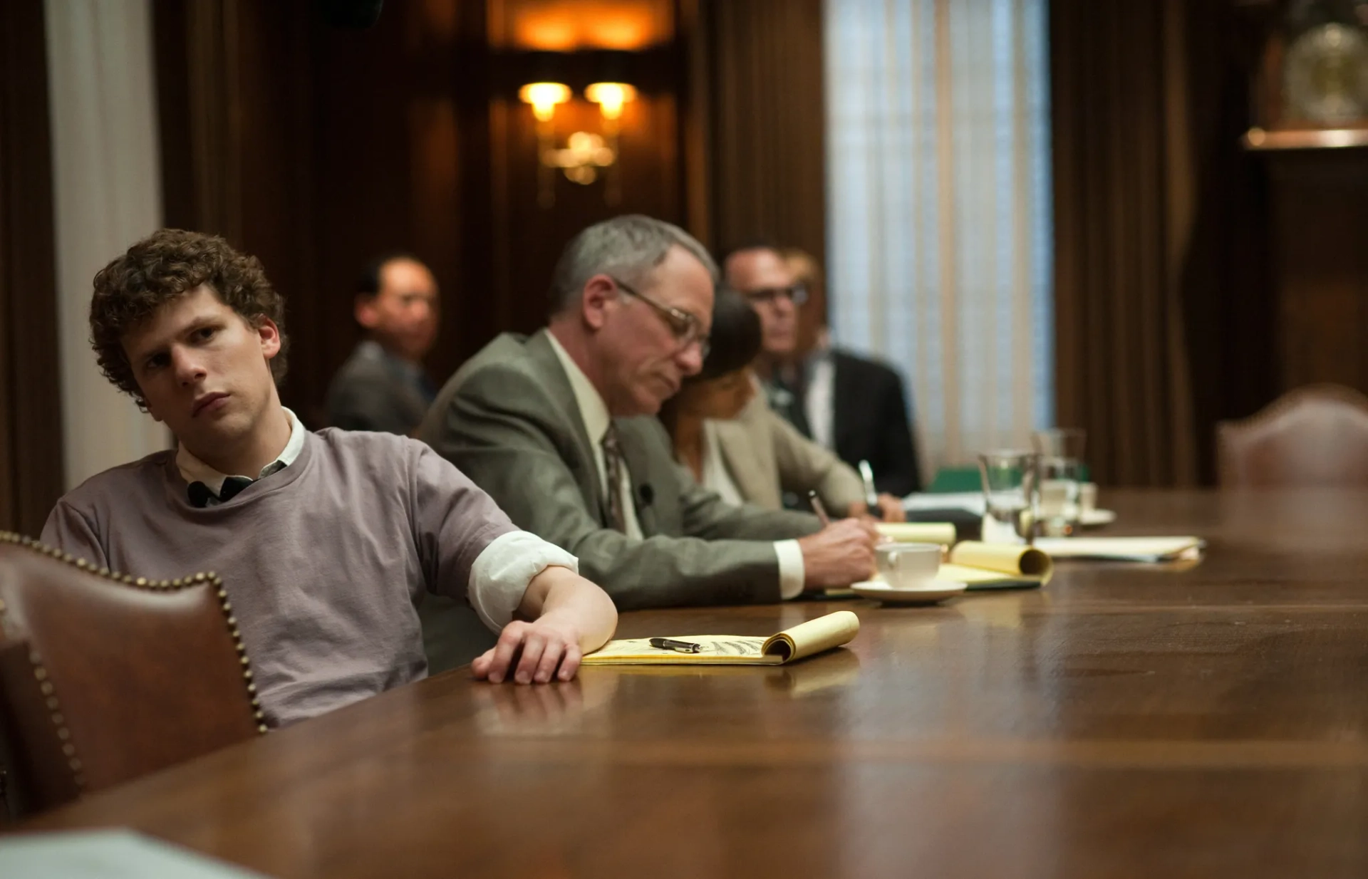 Jesse Eisenberg and John Getz in The Social Network (2010)