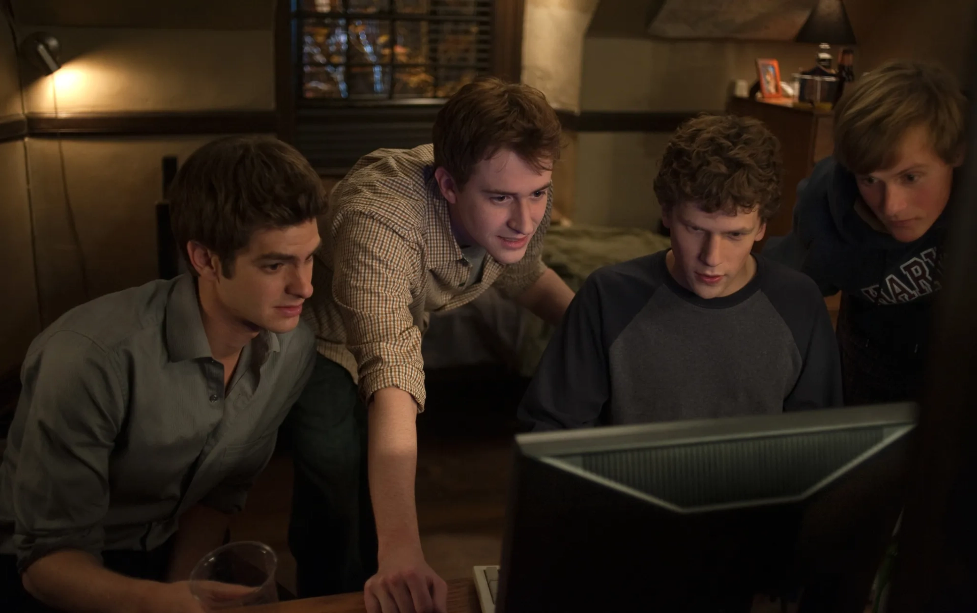 Joseph Mazzello, Jesse Eisenberg, Andrew Garfield, and Patrick Mapel in The Social Network (2010)